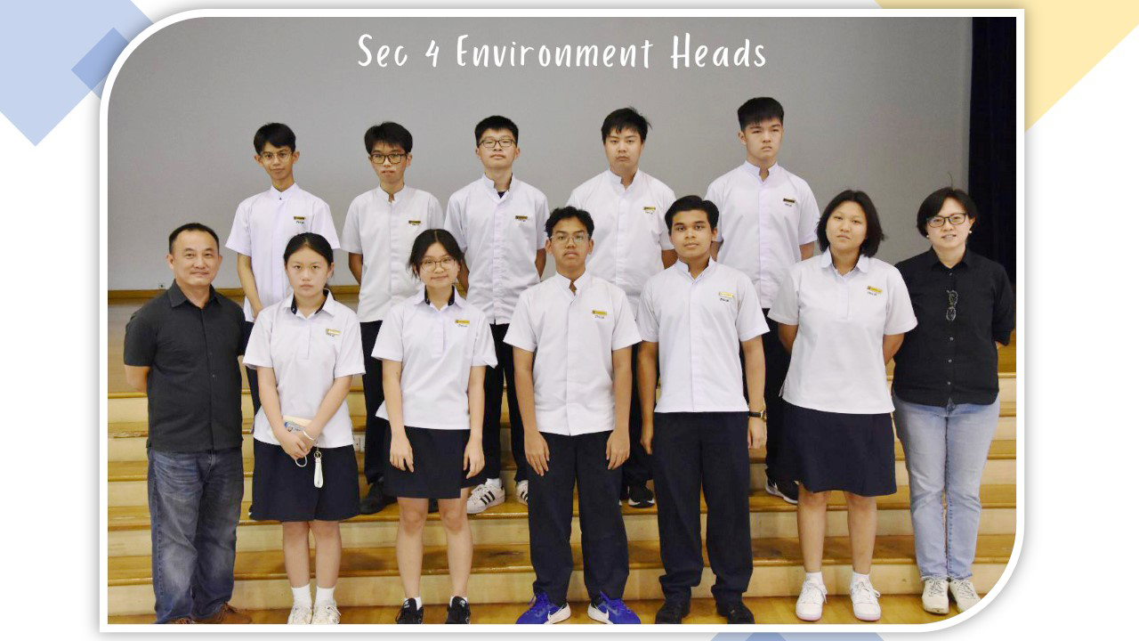 Group photo of Sec 4 Environment Heads, showing students in white uniforms with two adults on bleachers.