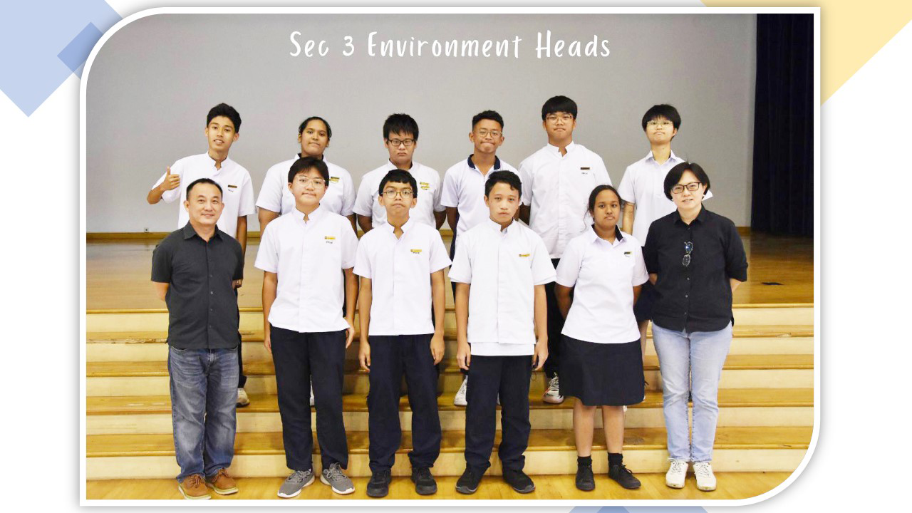 Group photo of Sec 3 Environment Heads, showing ten students in white uniforms and two adults on bleachers.