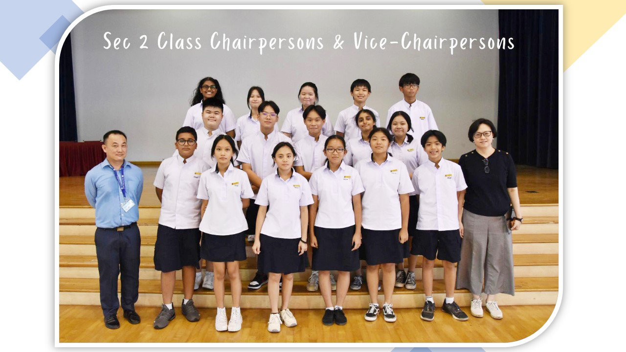 Group photo of Sec 2 Class Chairpersons and Vice-Chairpersons in white uniforms with two adult teachers.