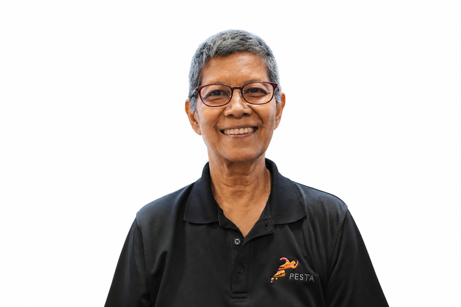 Academy Principal Melanie Ann Martens smiling in a black PESTA polo shirt
