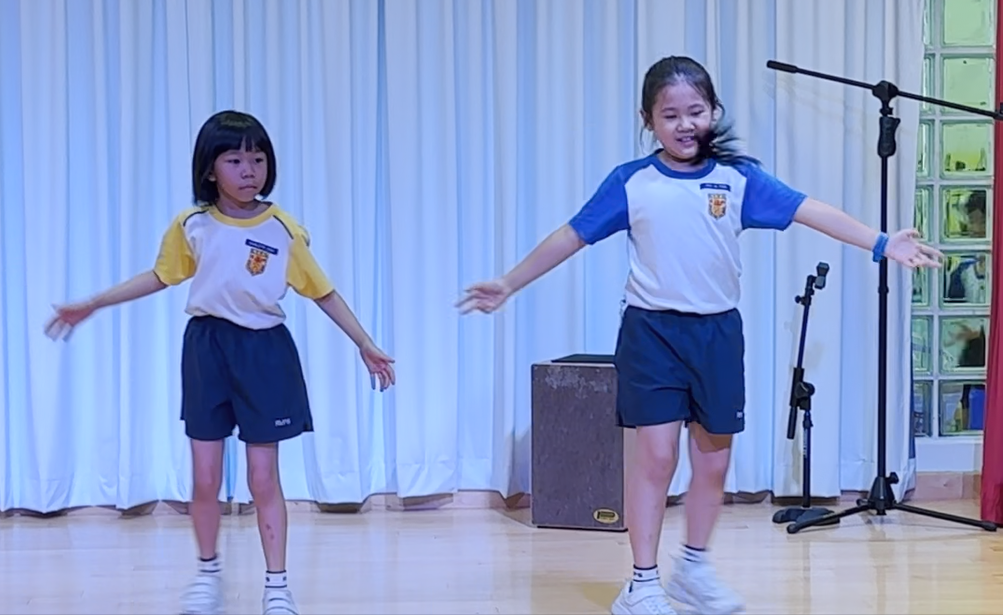 Student performing on stage, showcasing their talents.