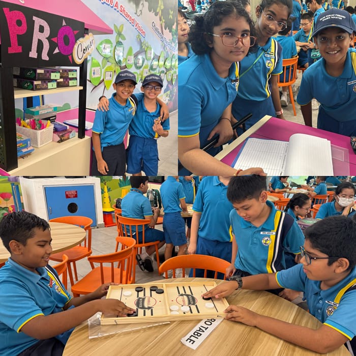 School children in blue uniforms pose and play board games in a colorful classroom setting.