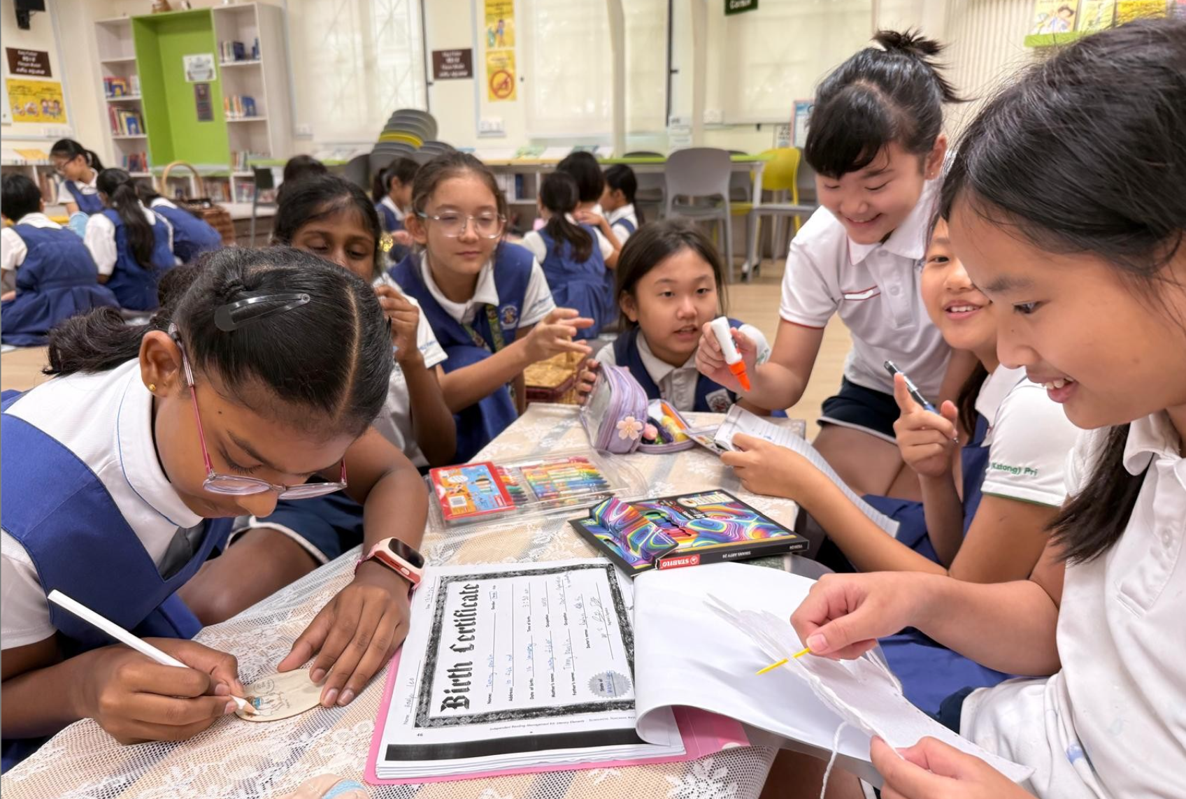 Students learn to write their picture books from a local author