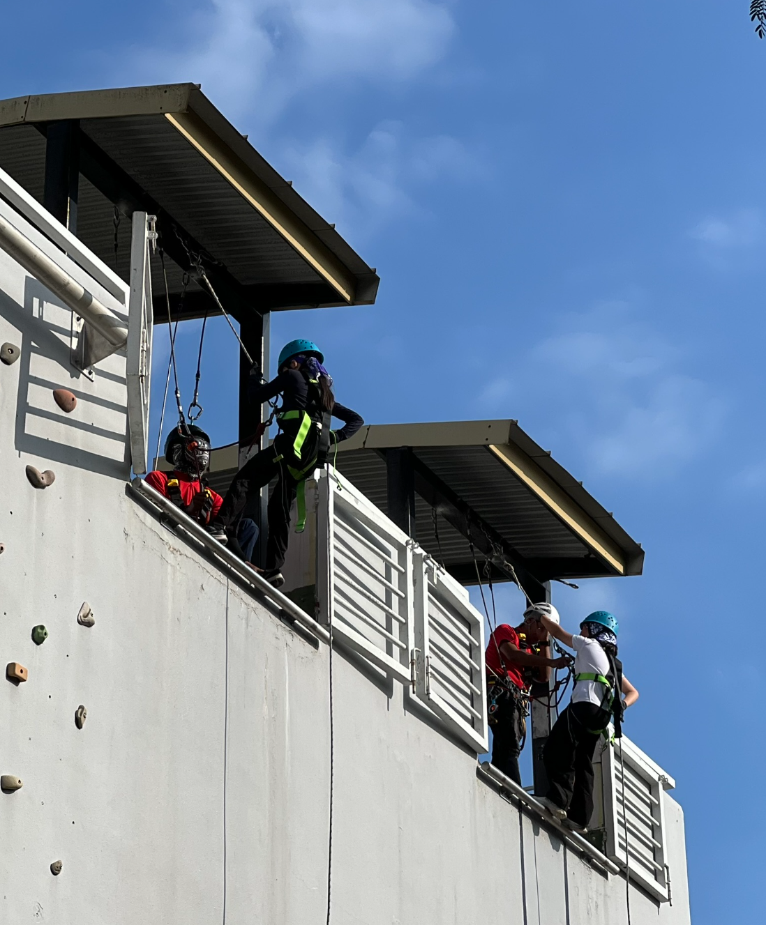 IJ girls trying out abseiling