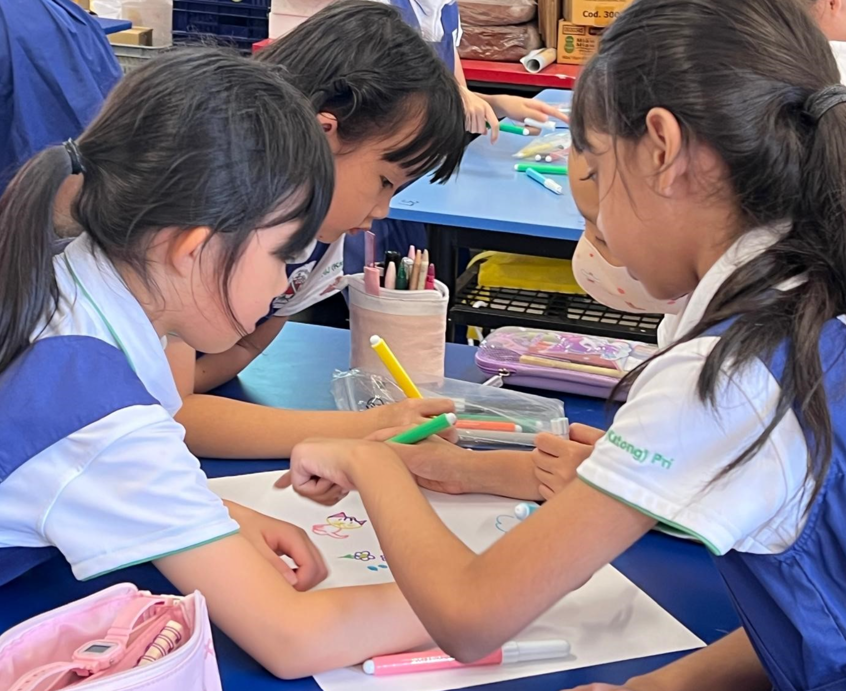 Art Club girls colouring during CCA