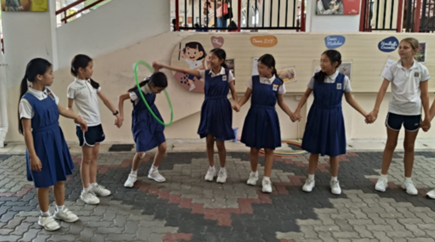 IJ girls with bonding activities at courtyard