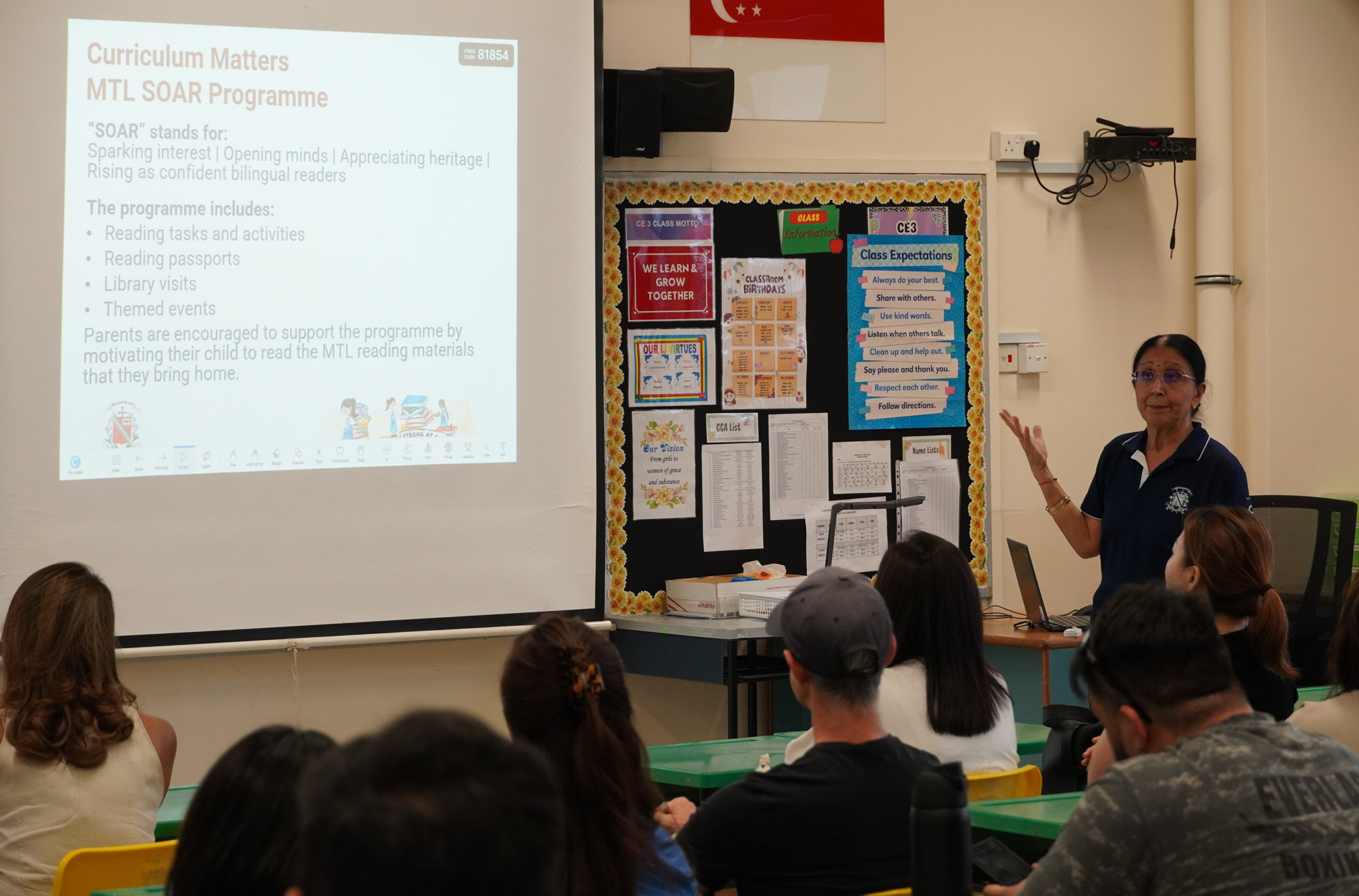 Teacher sharing curriculum matters with parents