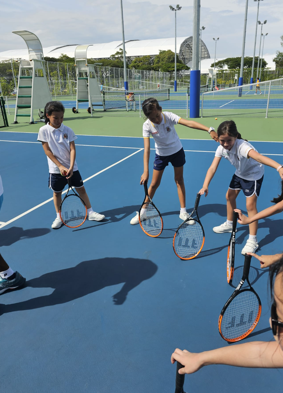 Sports Club girls attending tennis training