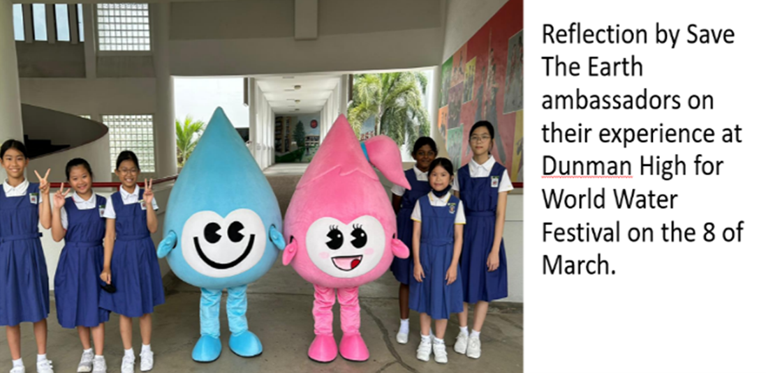 Five schoolgirls in blue uniforms pose with a blue and pink water drop mascot at a school event.