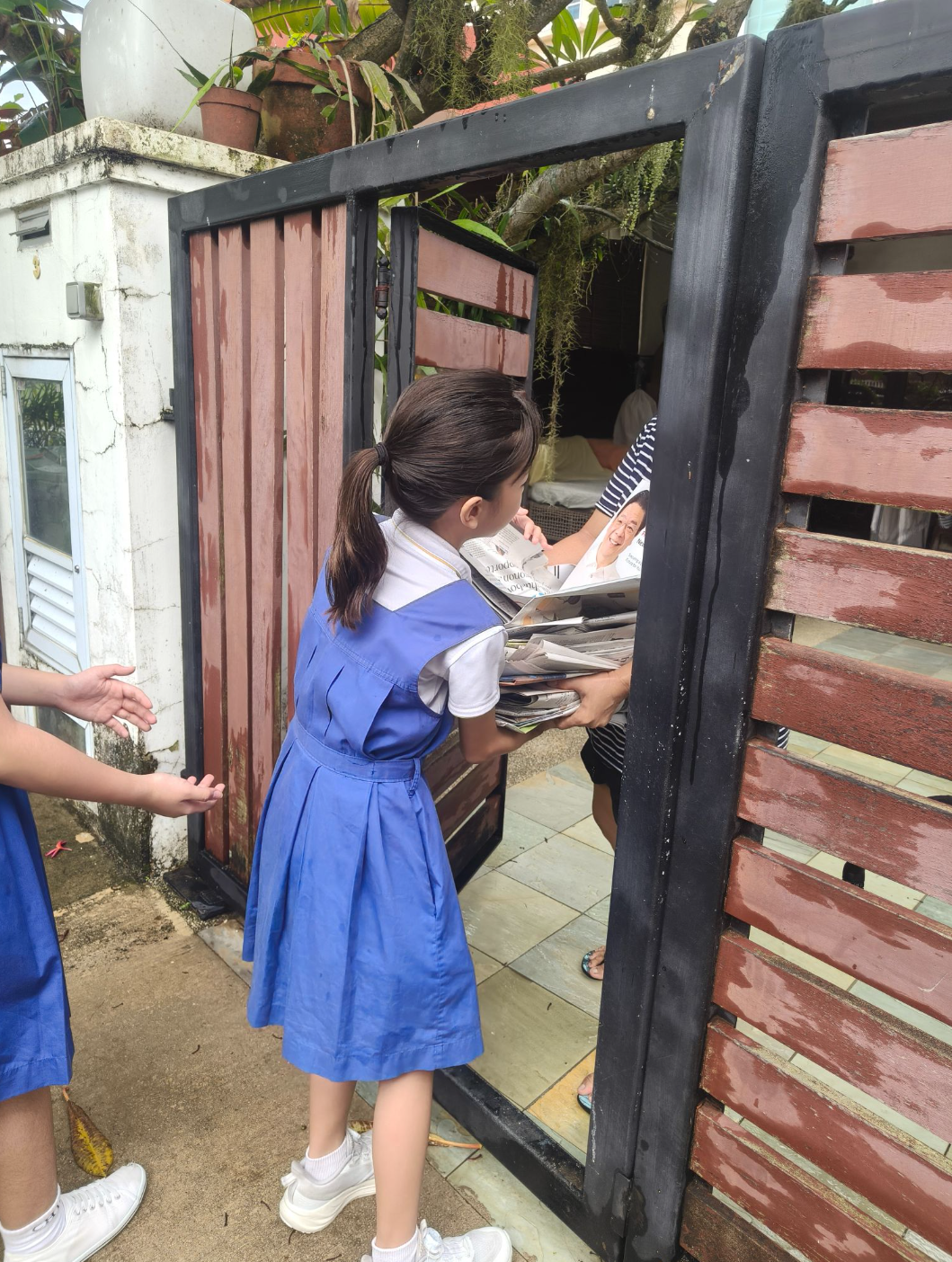 Students collecting recycled items