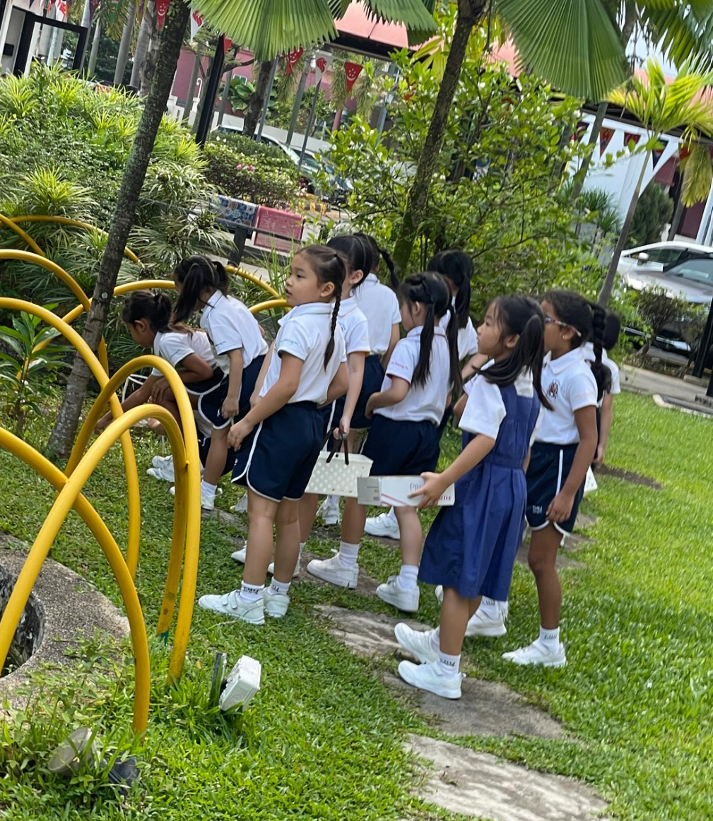 Students looking for items outdoor for their art work