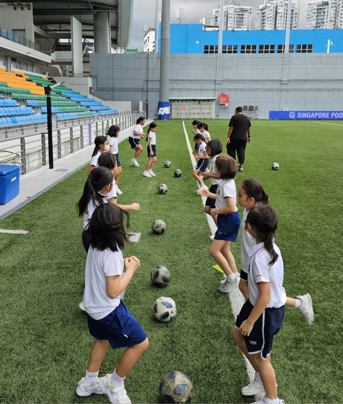Sports Club girls attending football training