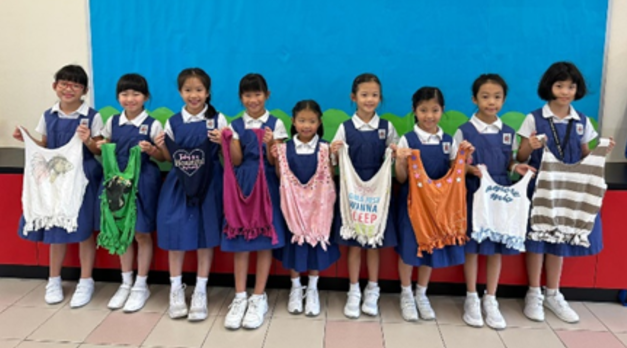 Students with old t-shirts as recycled bags