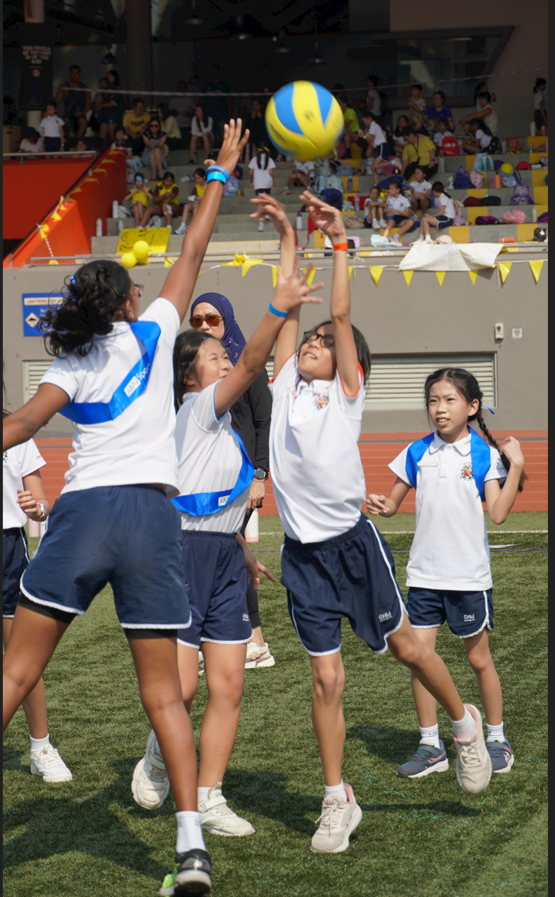 Students jumping for ball possesion during game time