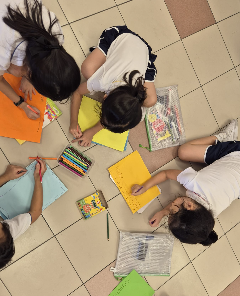 Students preparing their art work in classroom