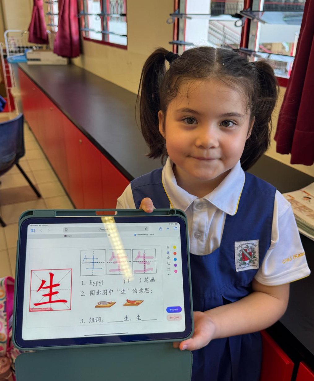 IJ girl completed school work on iPad
