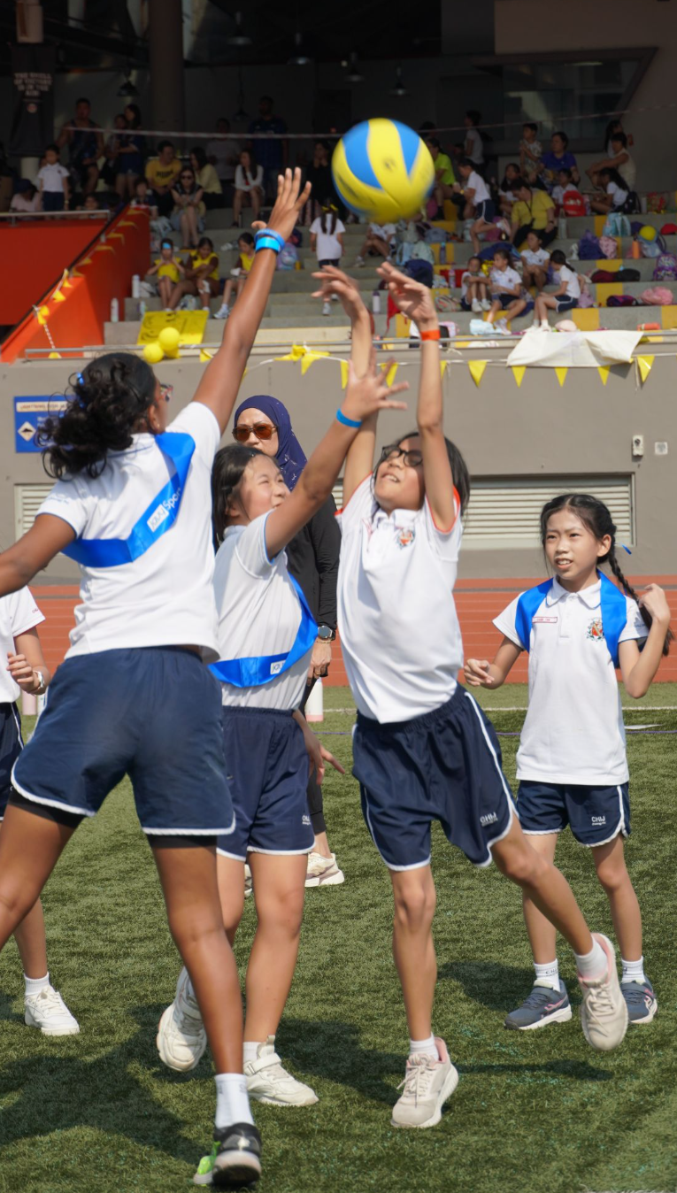 IJ girls jumping for ball during Annual Sports Carnival