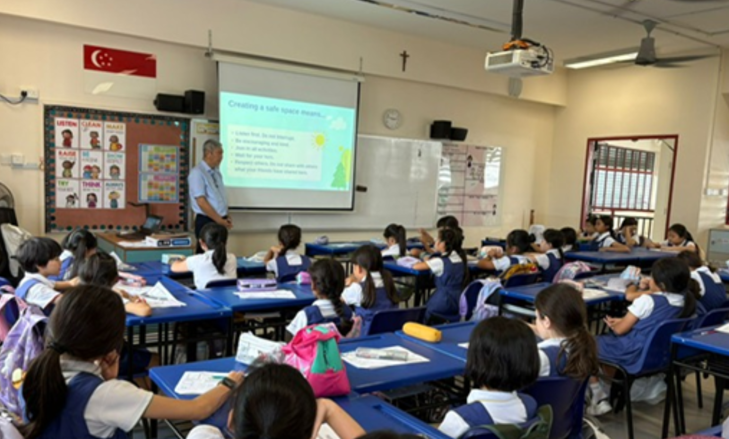 Teacher briefing the IJ girls in classroom
