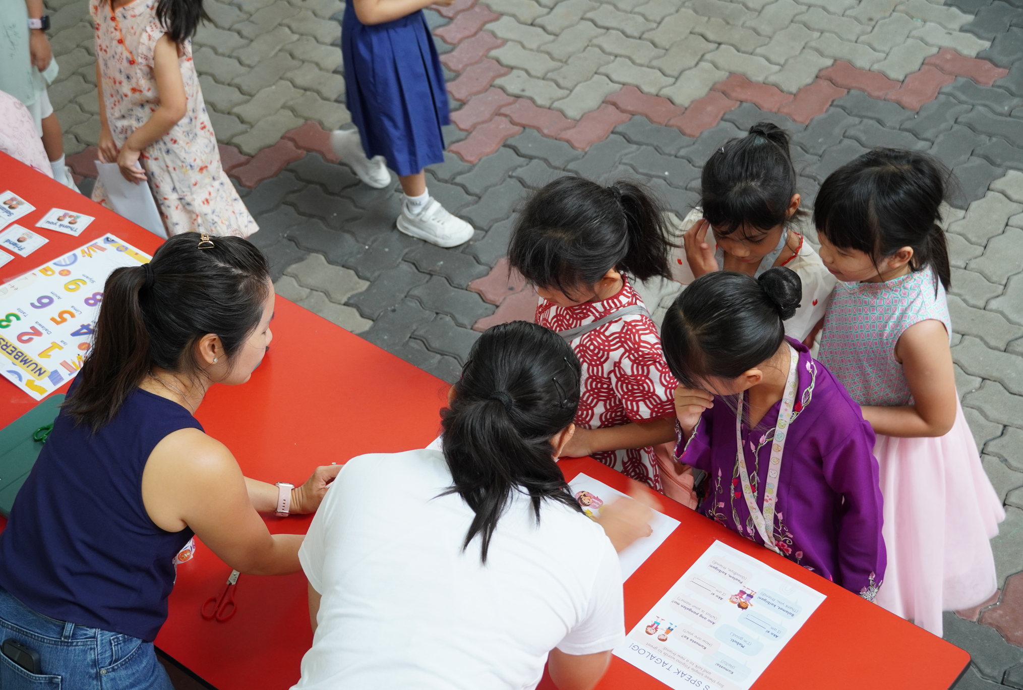 Parent volunteers helping out with International Friendship Day activities