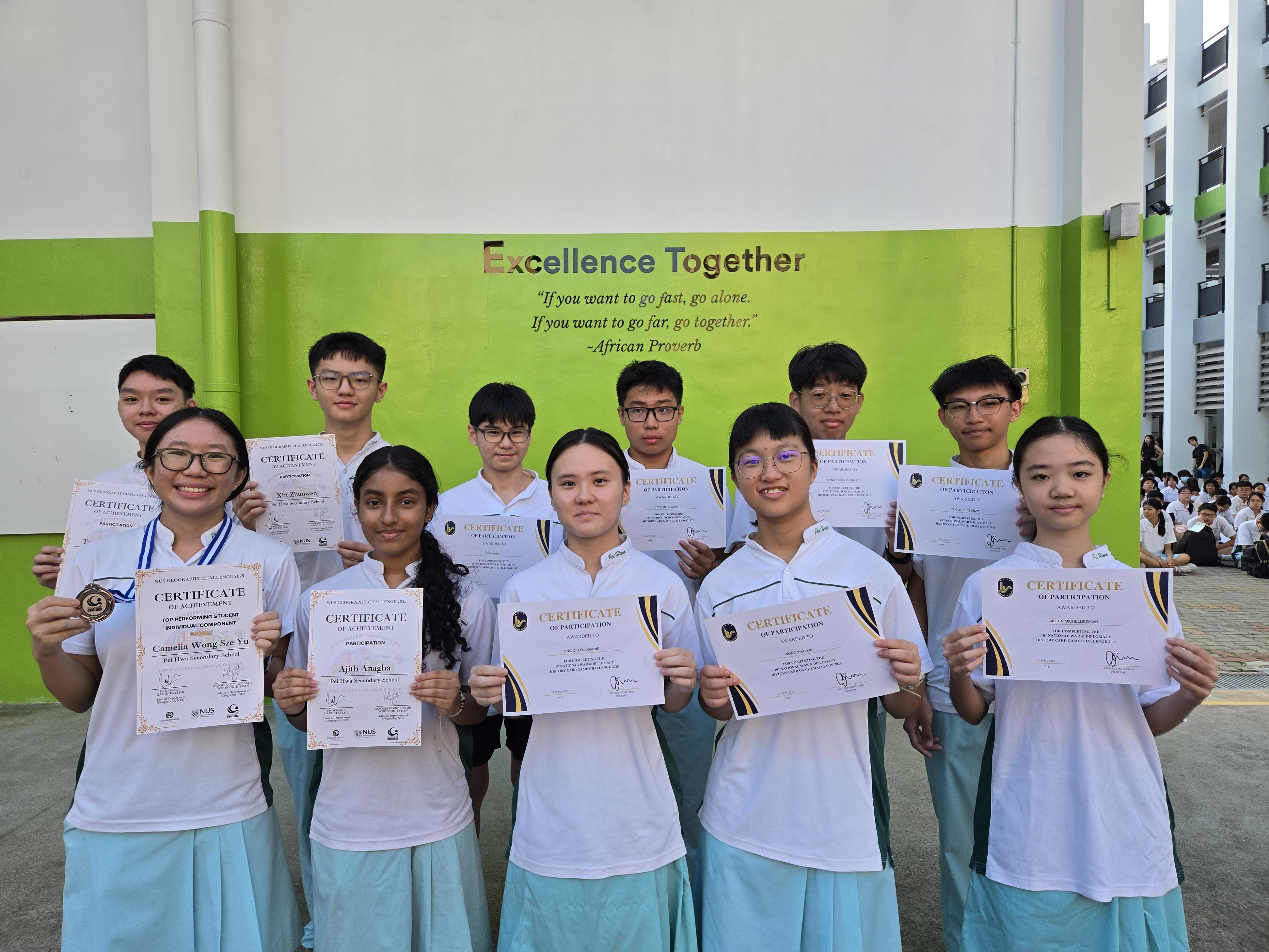 11 students standing with their certificates