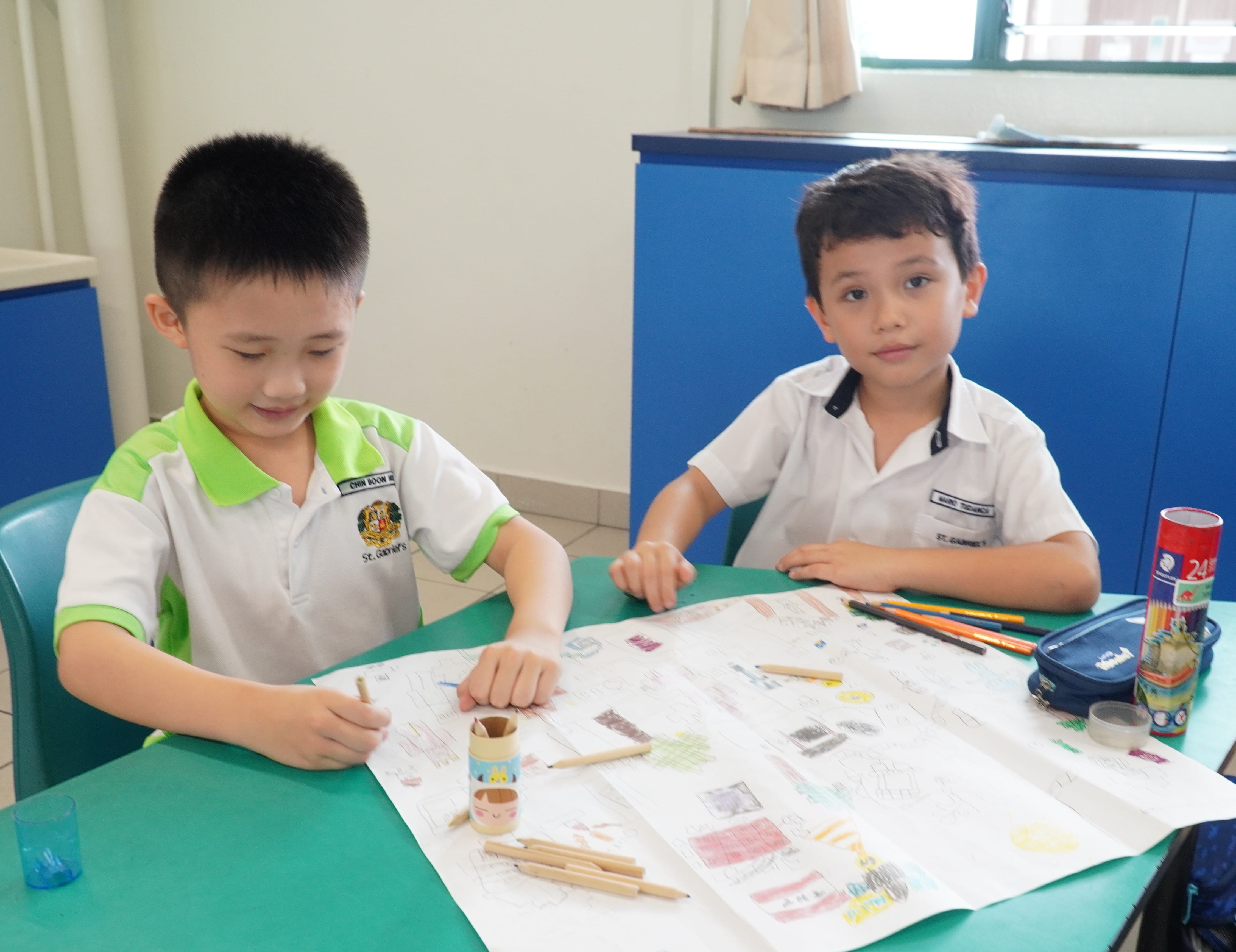 Two students participating in a drawing activity