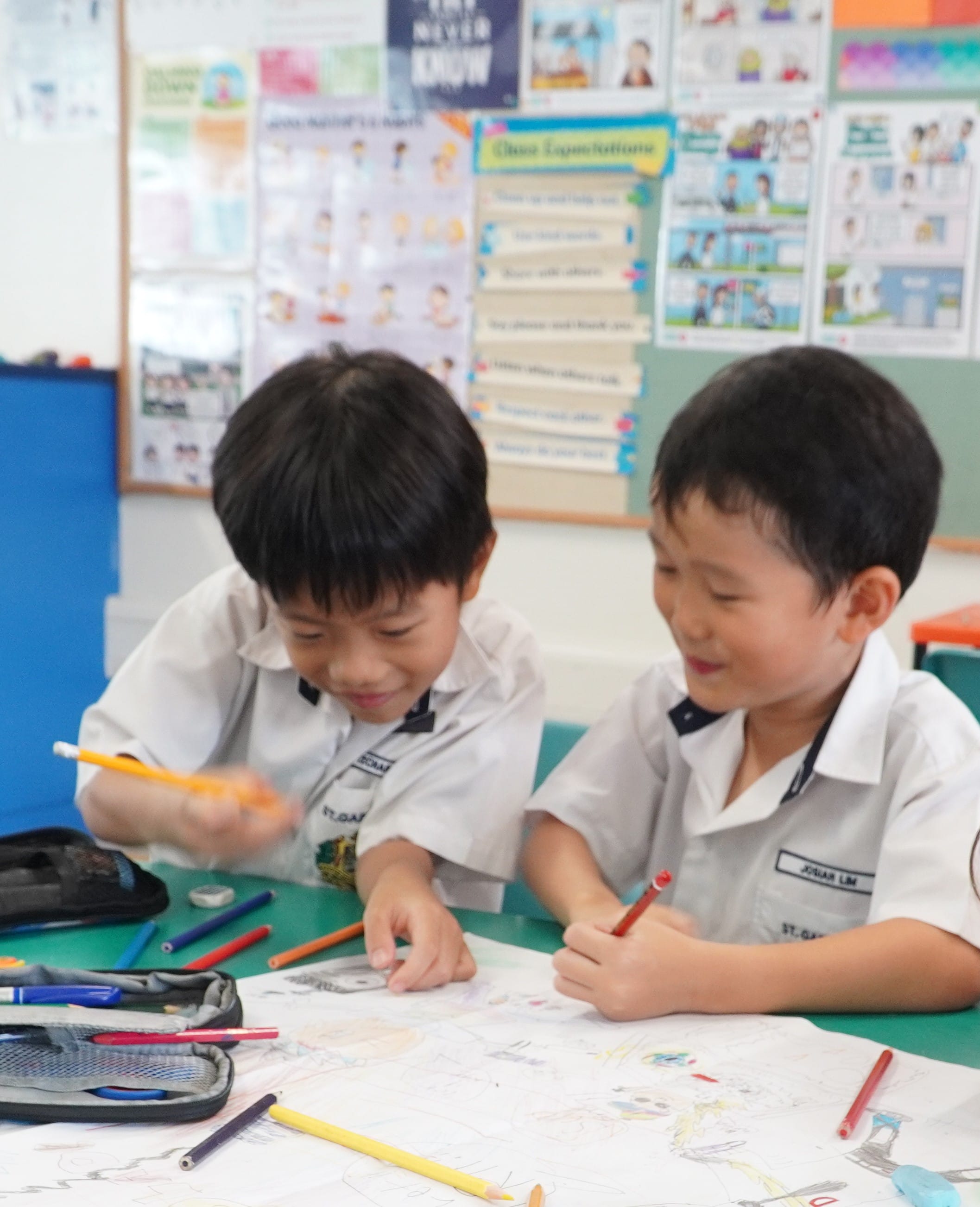 Two students participating in a drawing activity