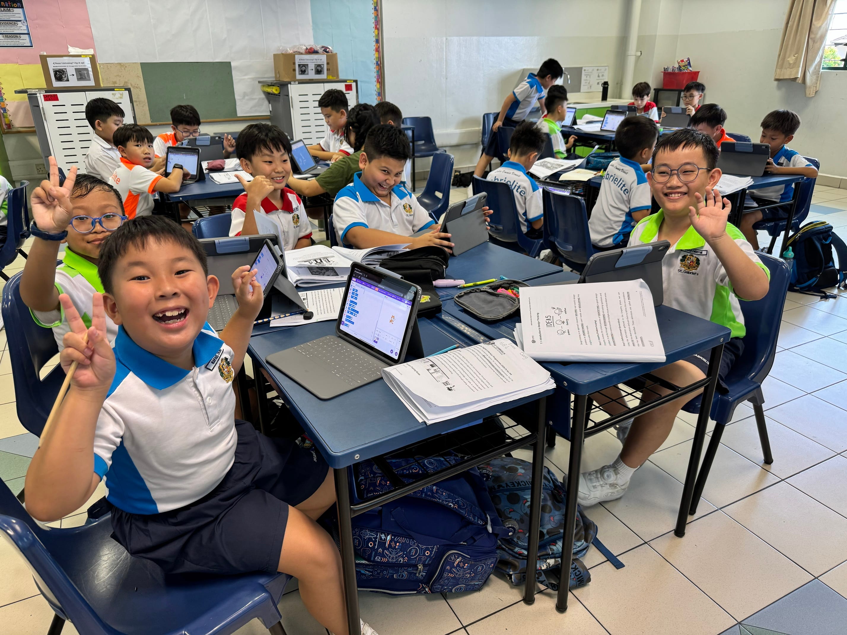 Students participating in coding using iPads