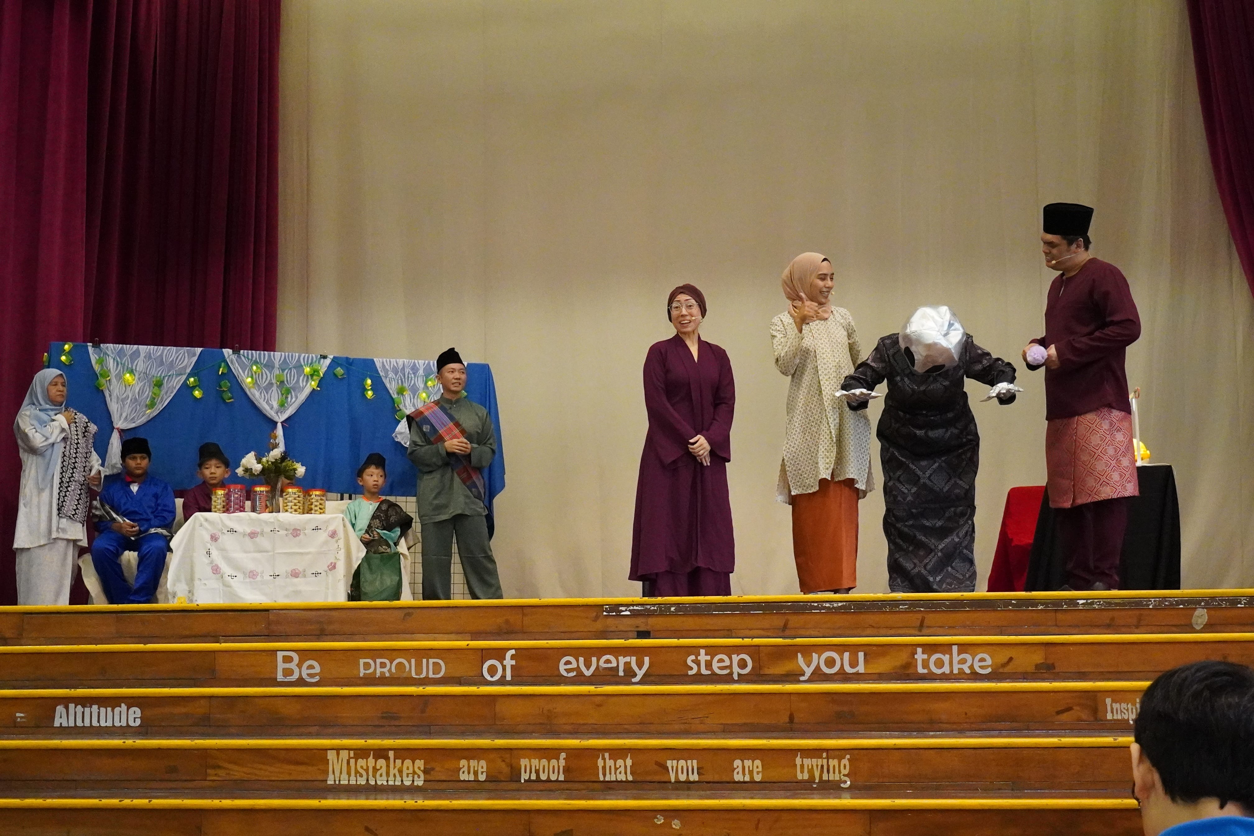 Students and teachers taking part in the Hari Raya activity in the school hall