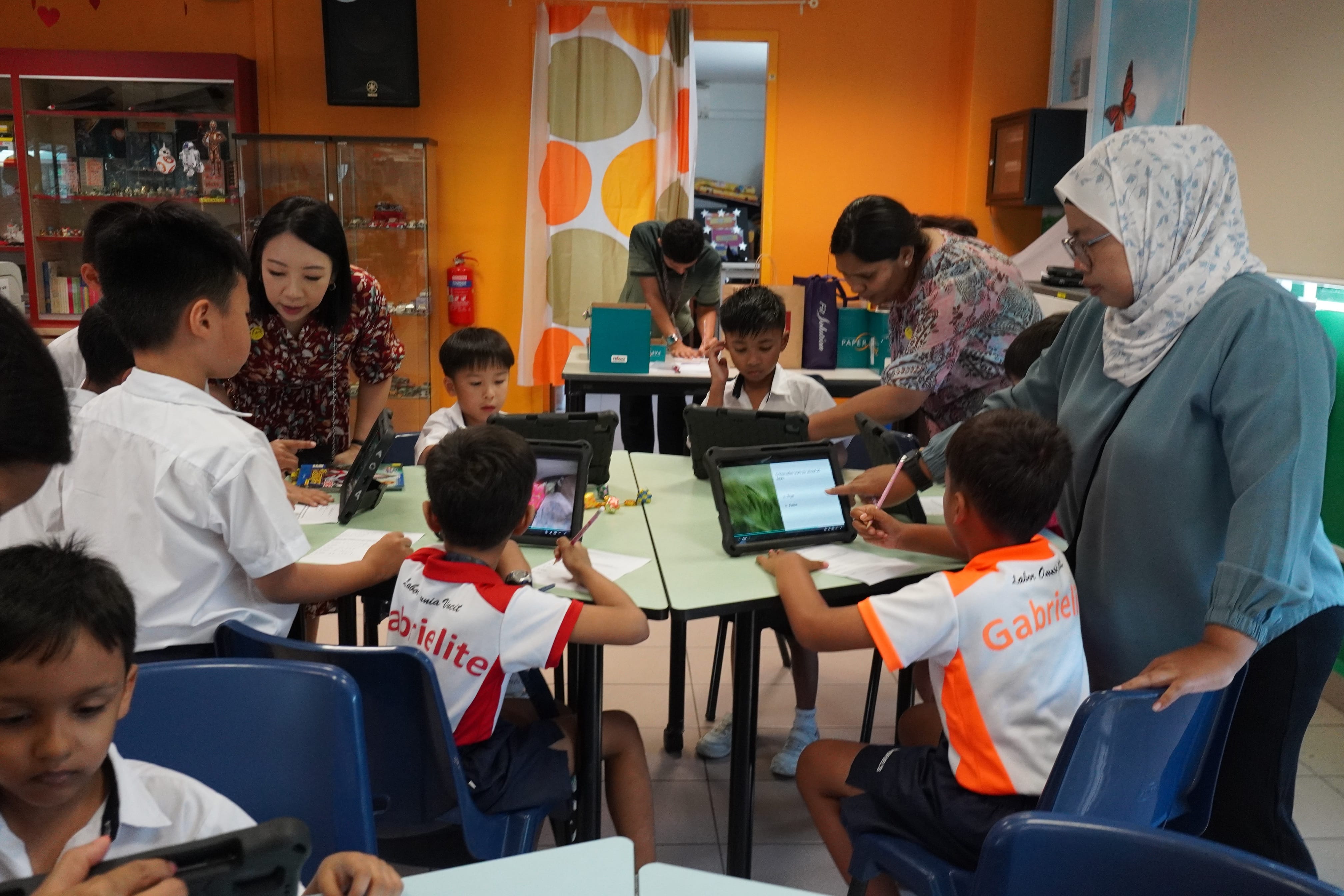 Students taking part in the Hari Raya activities in the school library