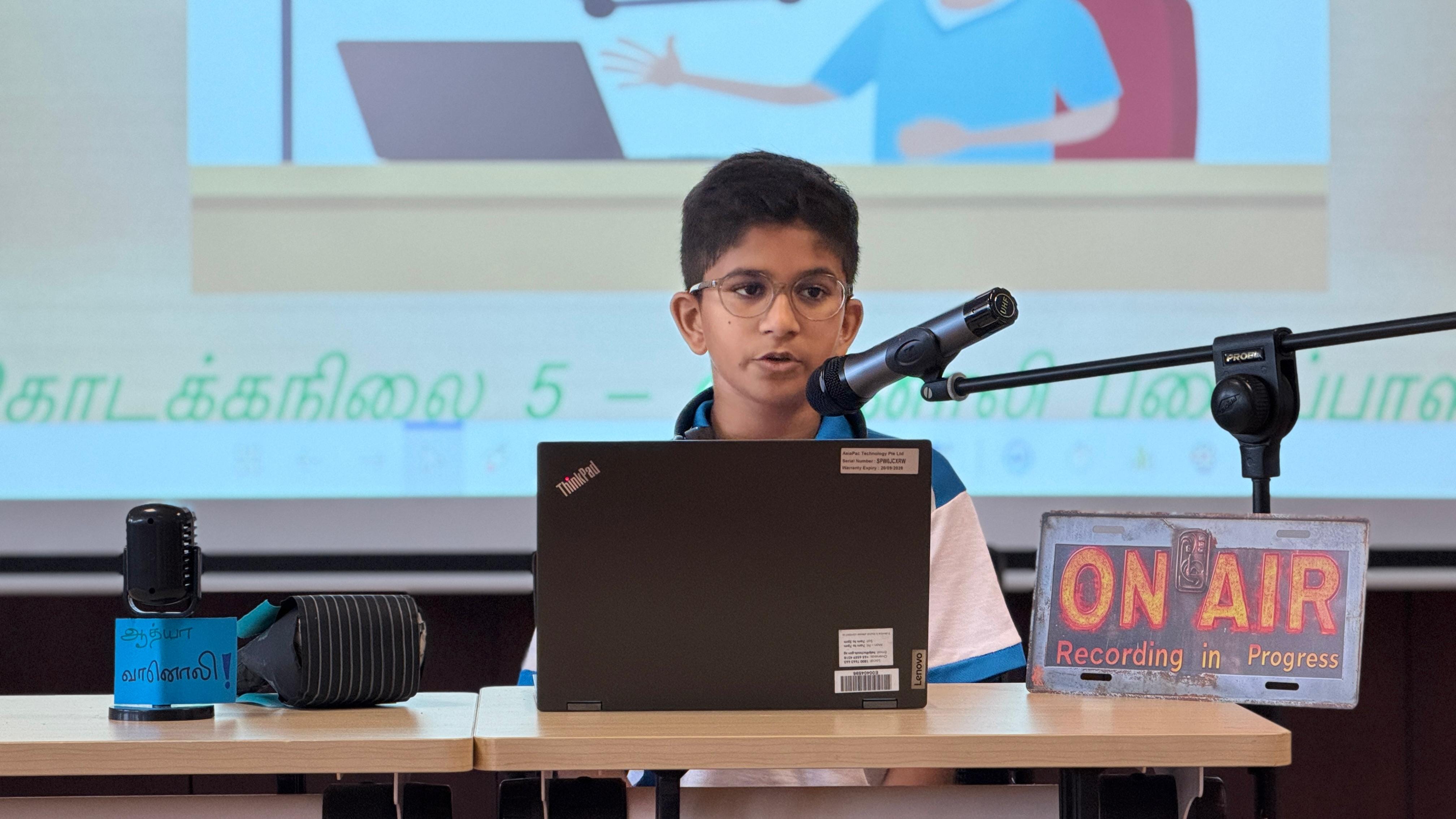 A student mimicking a radio DJ