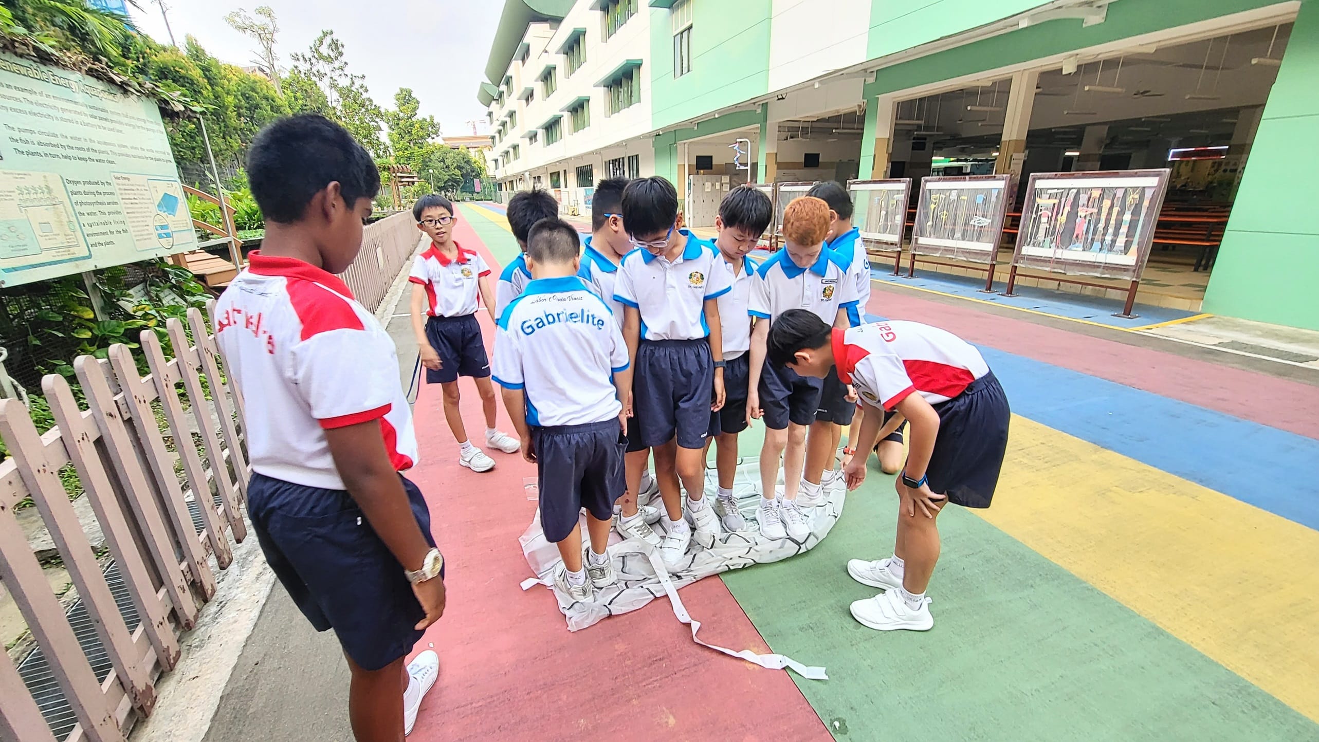 Students doing an activity on the running track