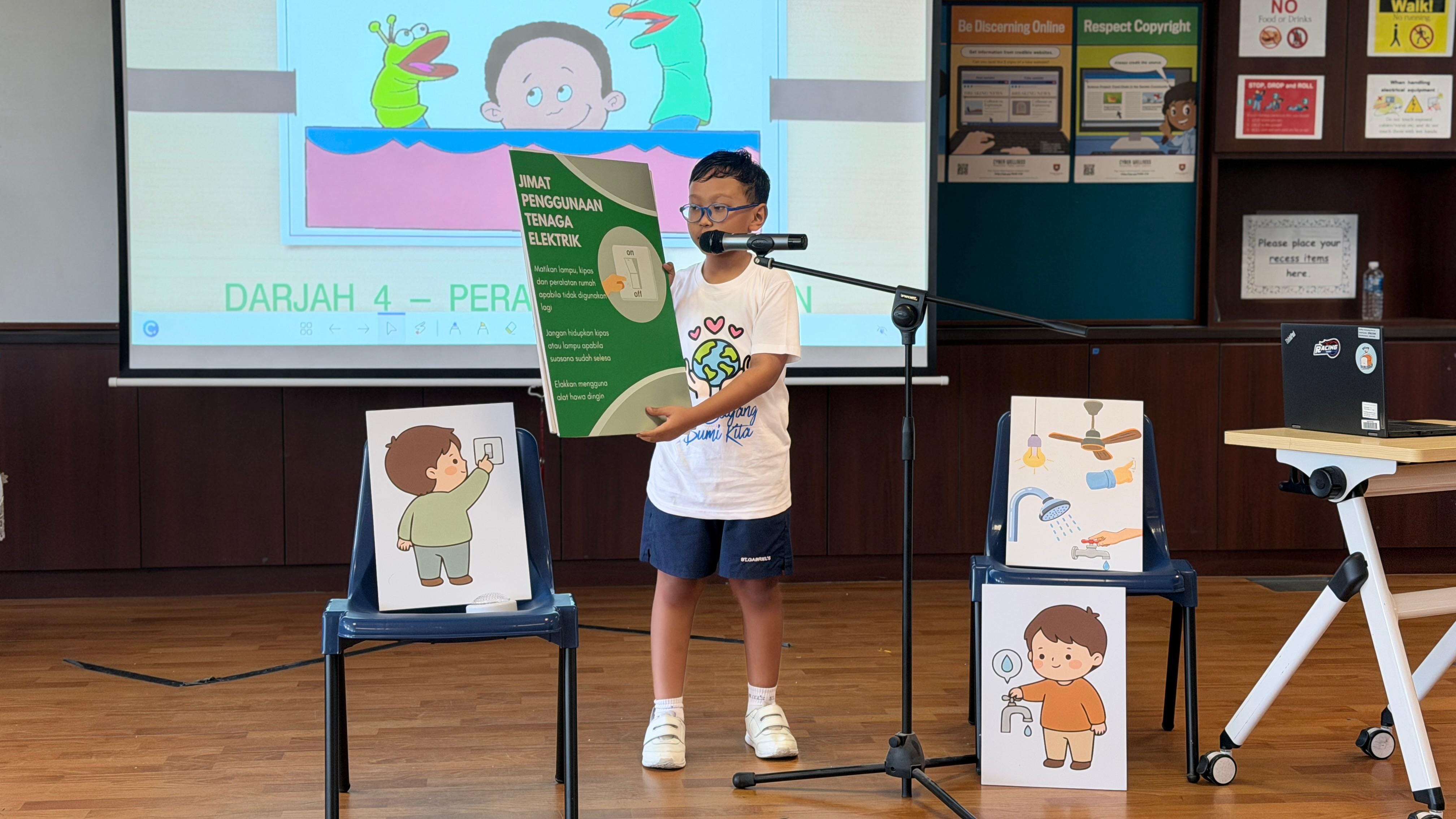 A student speaking through a microphone talking about electricity conservation