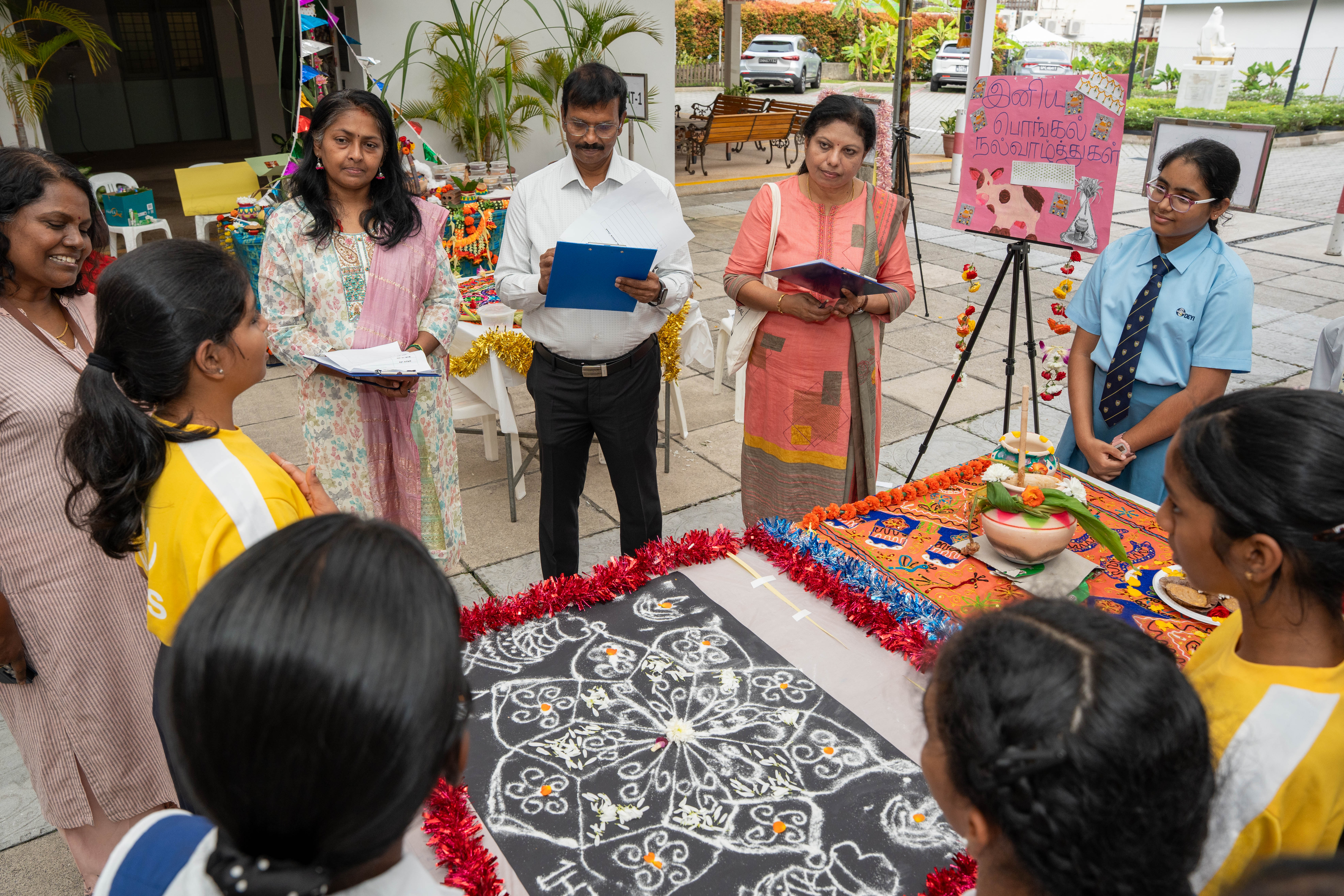 Parent and UPTLC Master Teachers judging students’ decorations and presentations during Pongal Day 1 Celebration 2026.