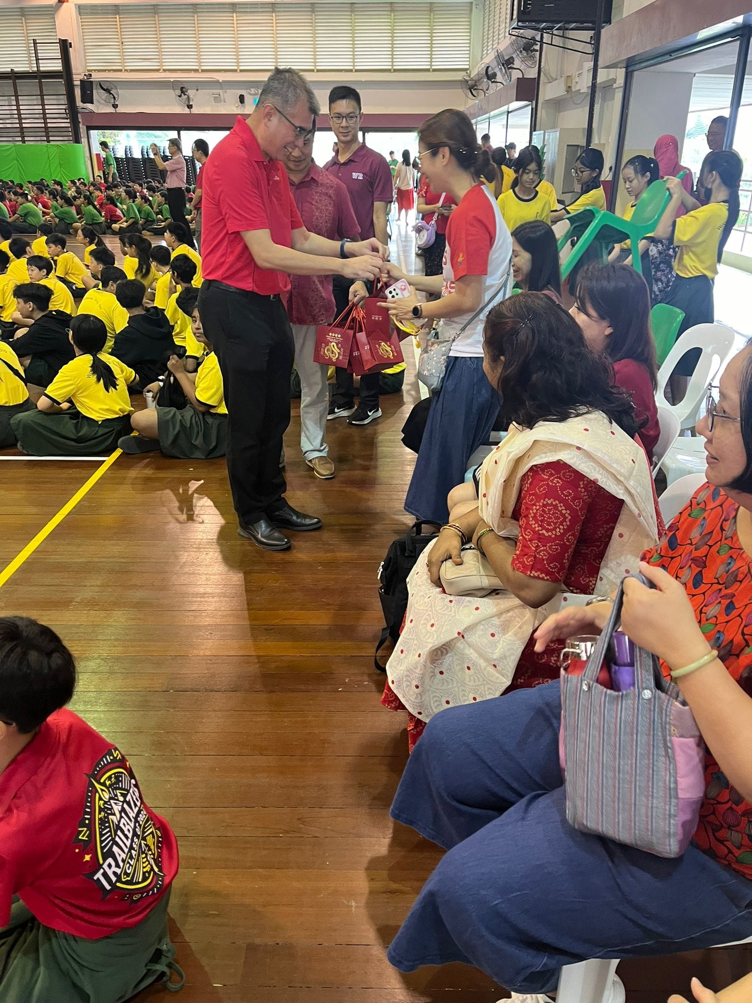 P giving oranges to parents