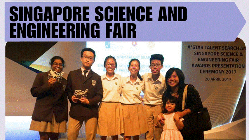Six students and an adult with a child pose at the 2017 Singapore Science and Engineering Fair awards ceremony.