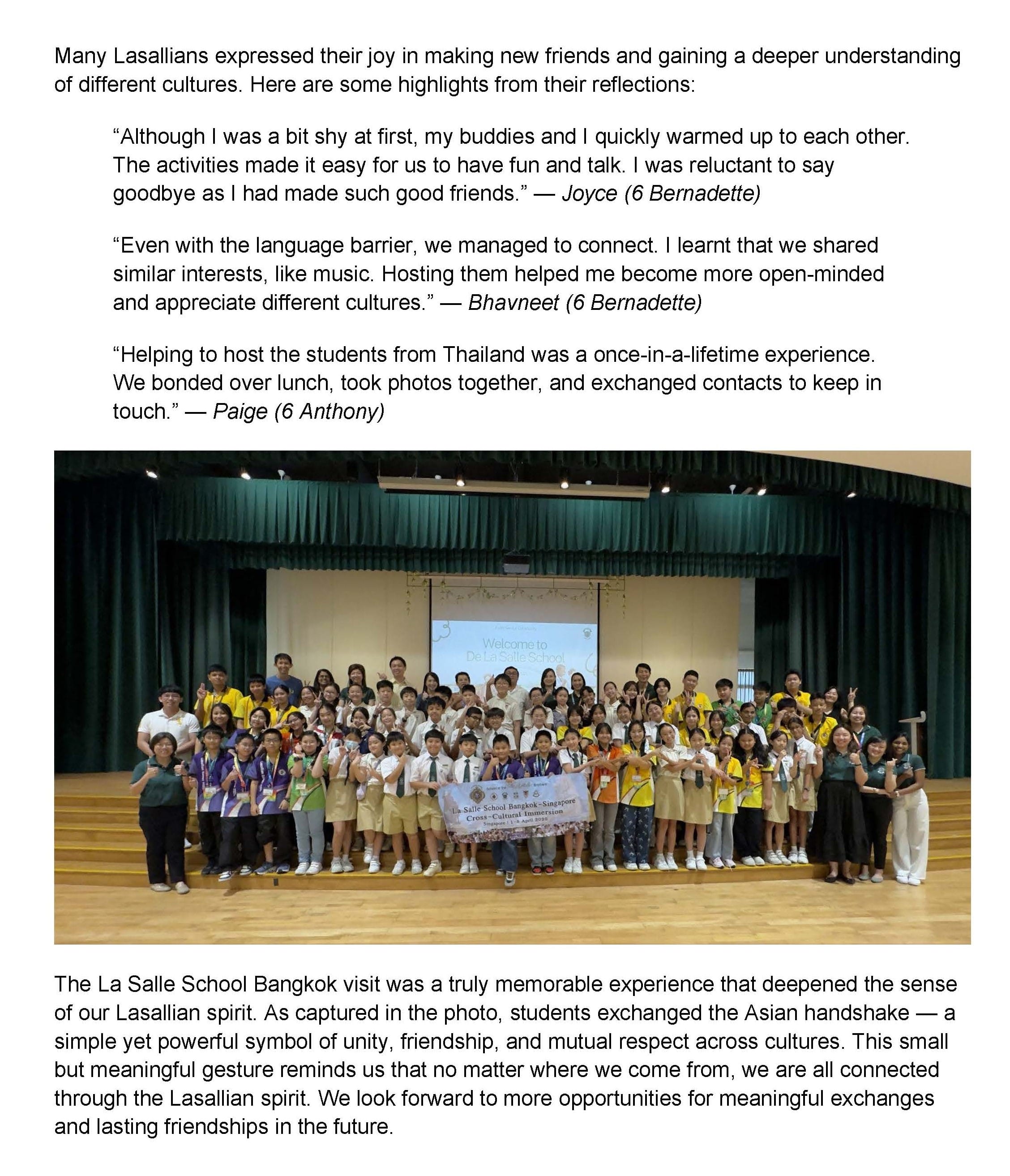 Large group of students and teachers posing on a school stage holding a La Salle Bangkok-Singapore banner.