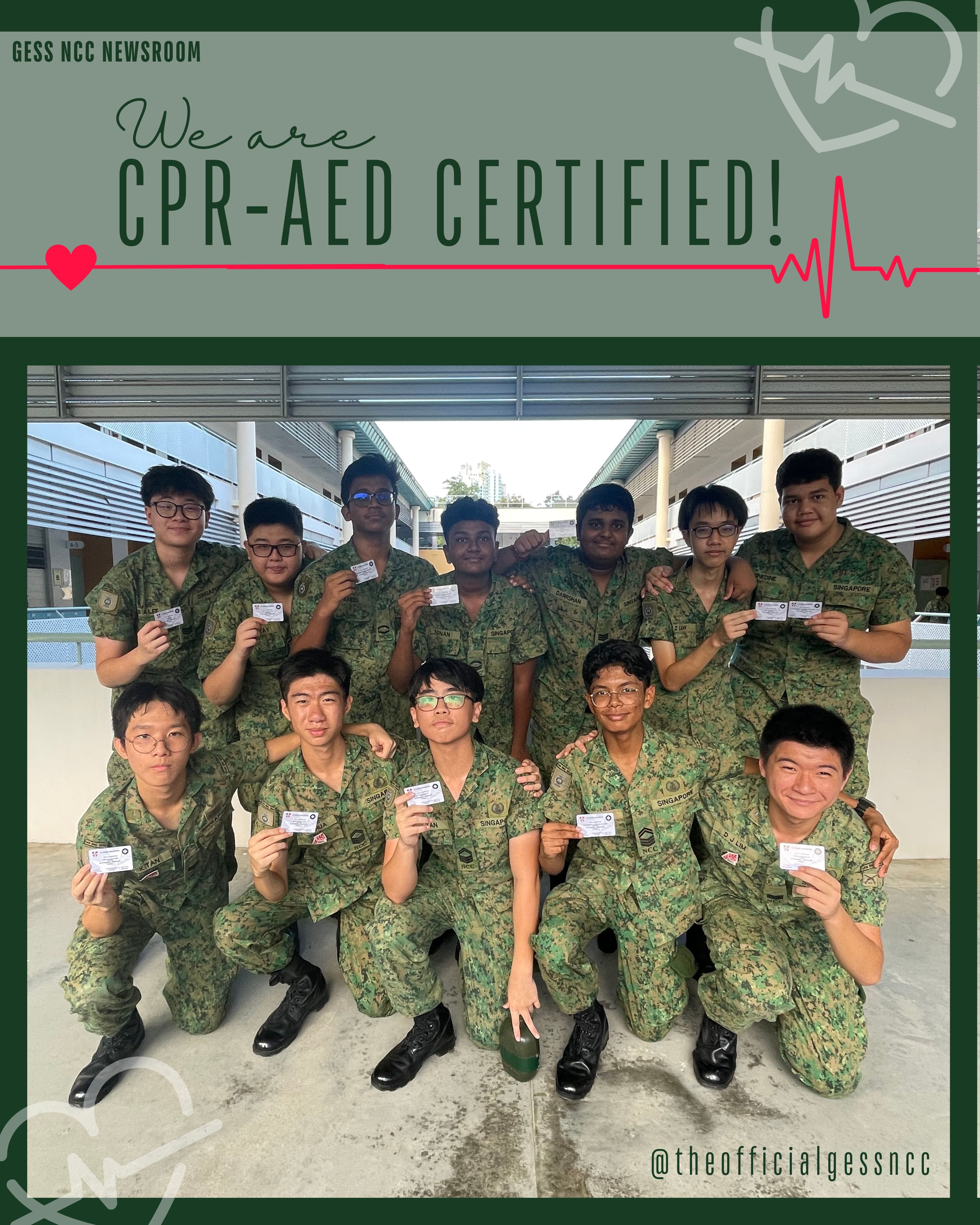 Eleven students in camouflage uniforms hold up CPR-AED certification cards under a green banner reading We are CPR-AED Certified.