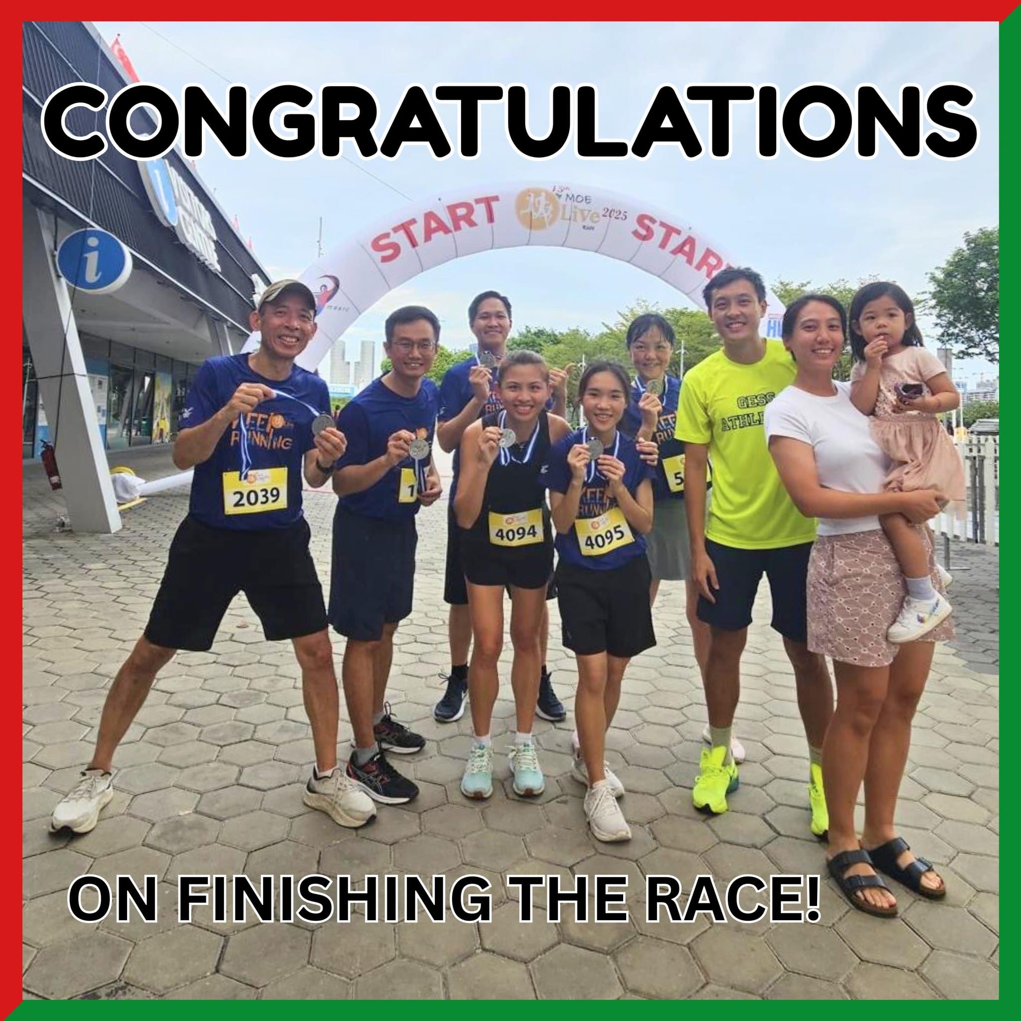 Group of runners holding medals under a START arch at the MOE Live Run 2023, with congratulations text overlay.