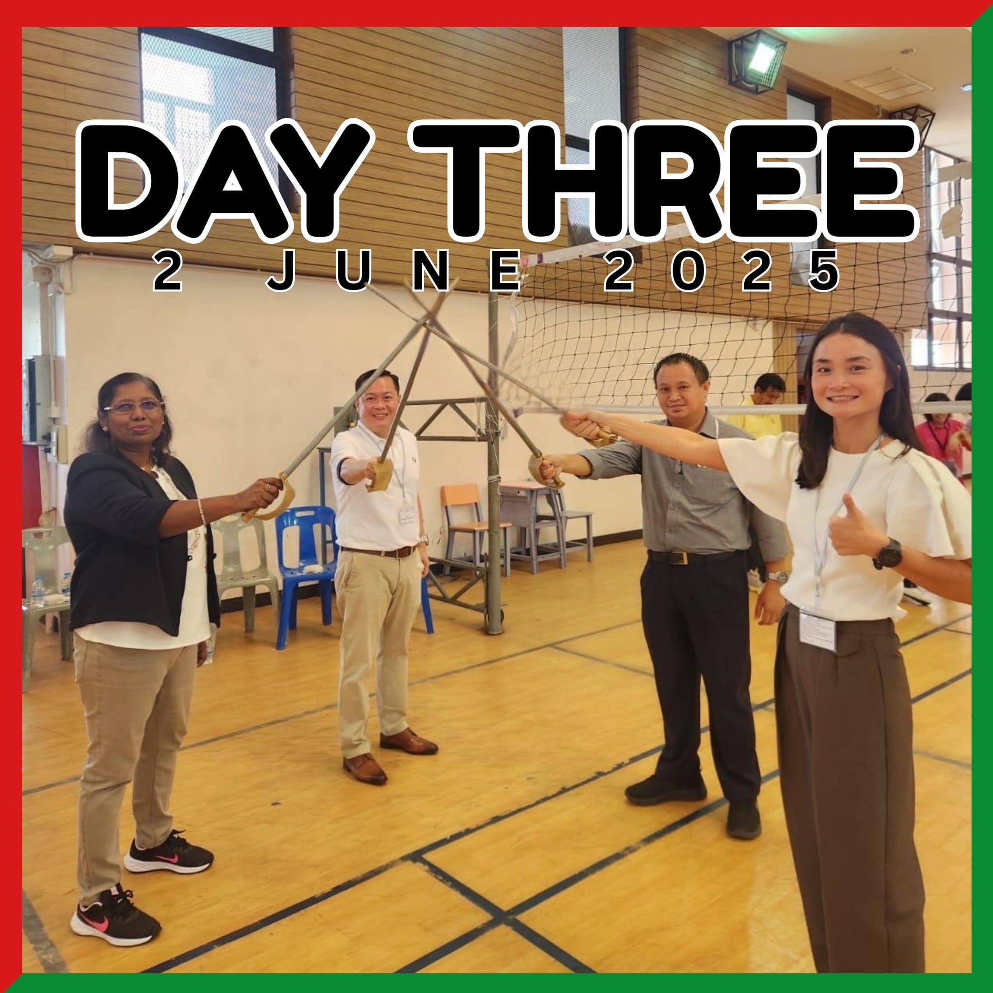 Four people in a gymnasium hold toy swords together, with text reading Day Three, 2 June 2025 overhead.