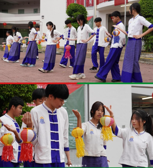 Students in white and blue traditional outfits perform a cultural dance holding colorful paper lanterns outdoors.