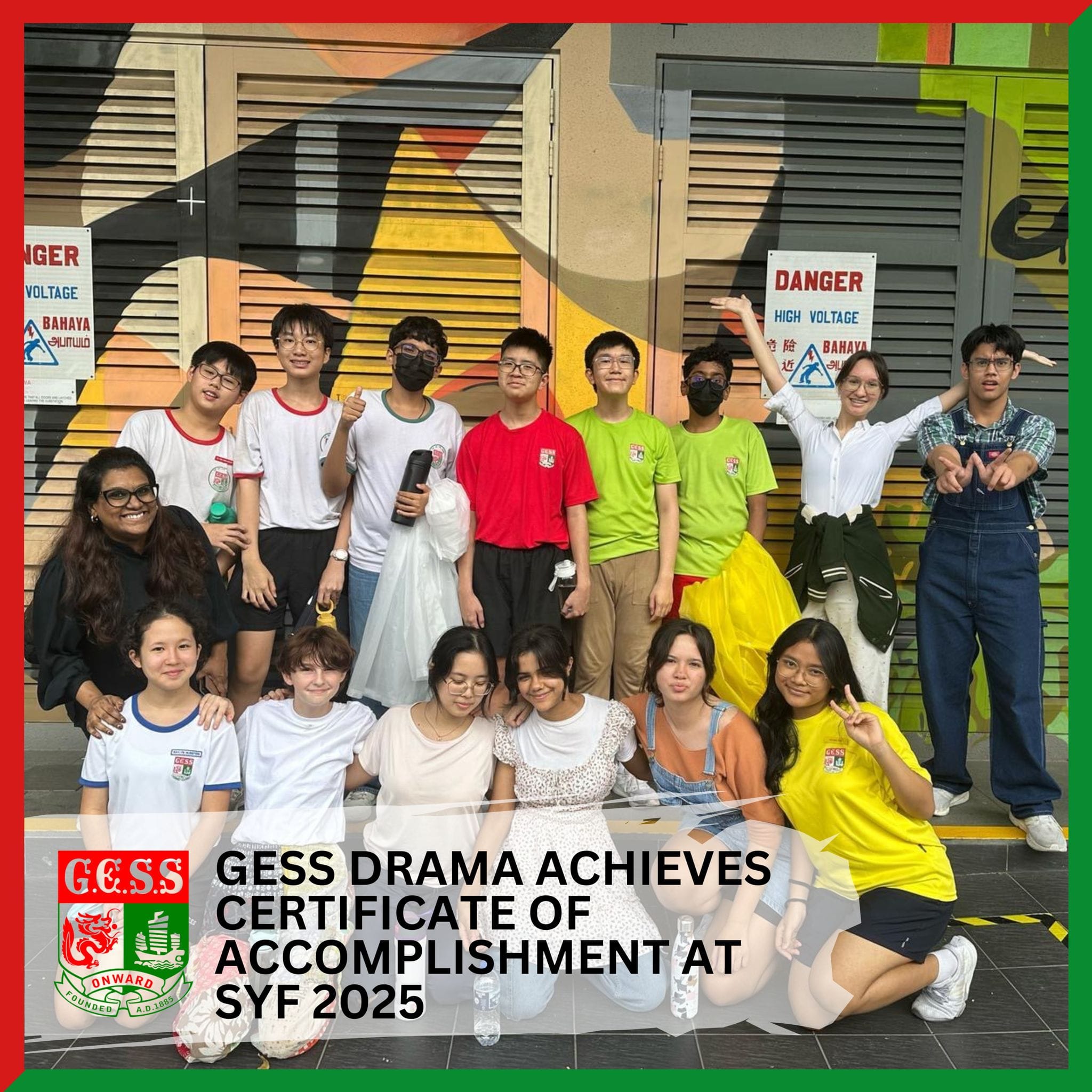 Group of teens and an adult posing outdoors near a colorful mural, celebrating GESS Drama's SYF 2025 achievement.