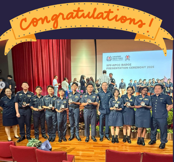 Group of uniformed cadets holding badges at the SPF-NPCC Badge Presentation Ceremony 2025 on stage.