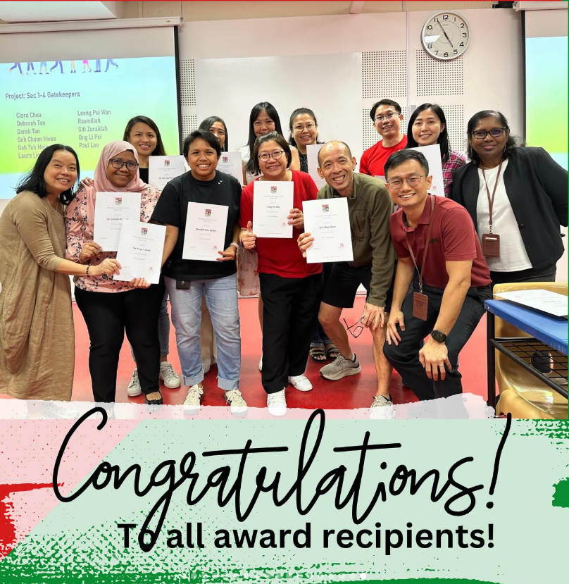 A group of smiling people holding certificates pose together indoors with text reading Congratulations To all award recipients.