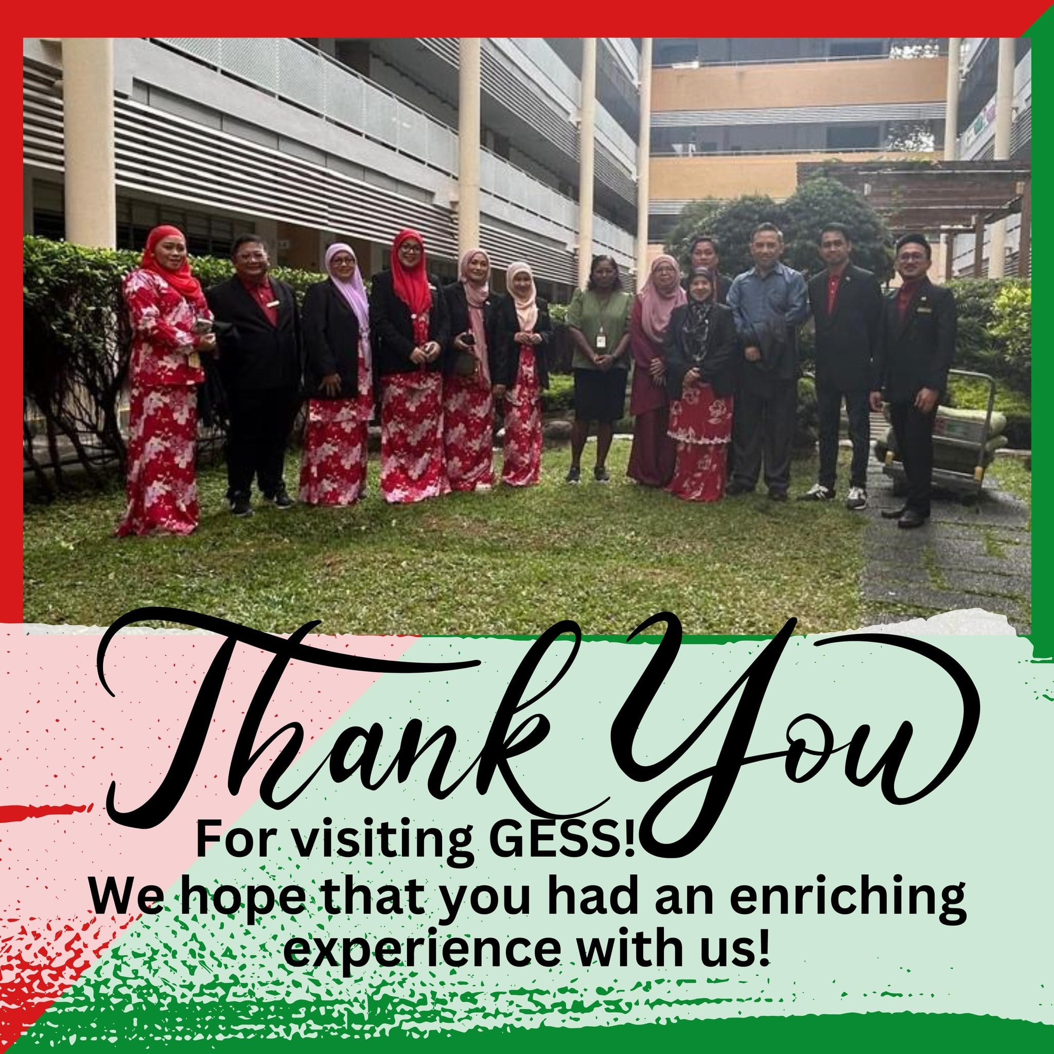 Group of people in traditional red floral attire posing outdoors near a building, with text "Thank You for visiting GESS!"