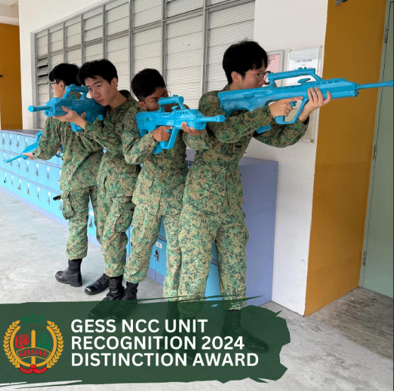 Four youths in camouflage uniforms aim blue training rifles along a wall, with text reading GESS NCC Unit Recognition 2024 Distinction Award.