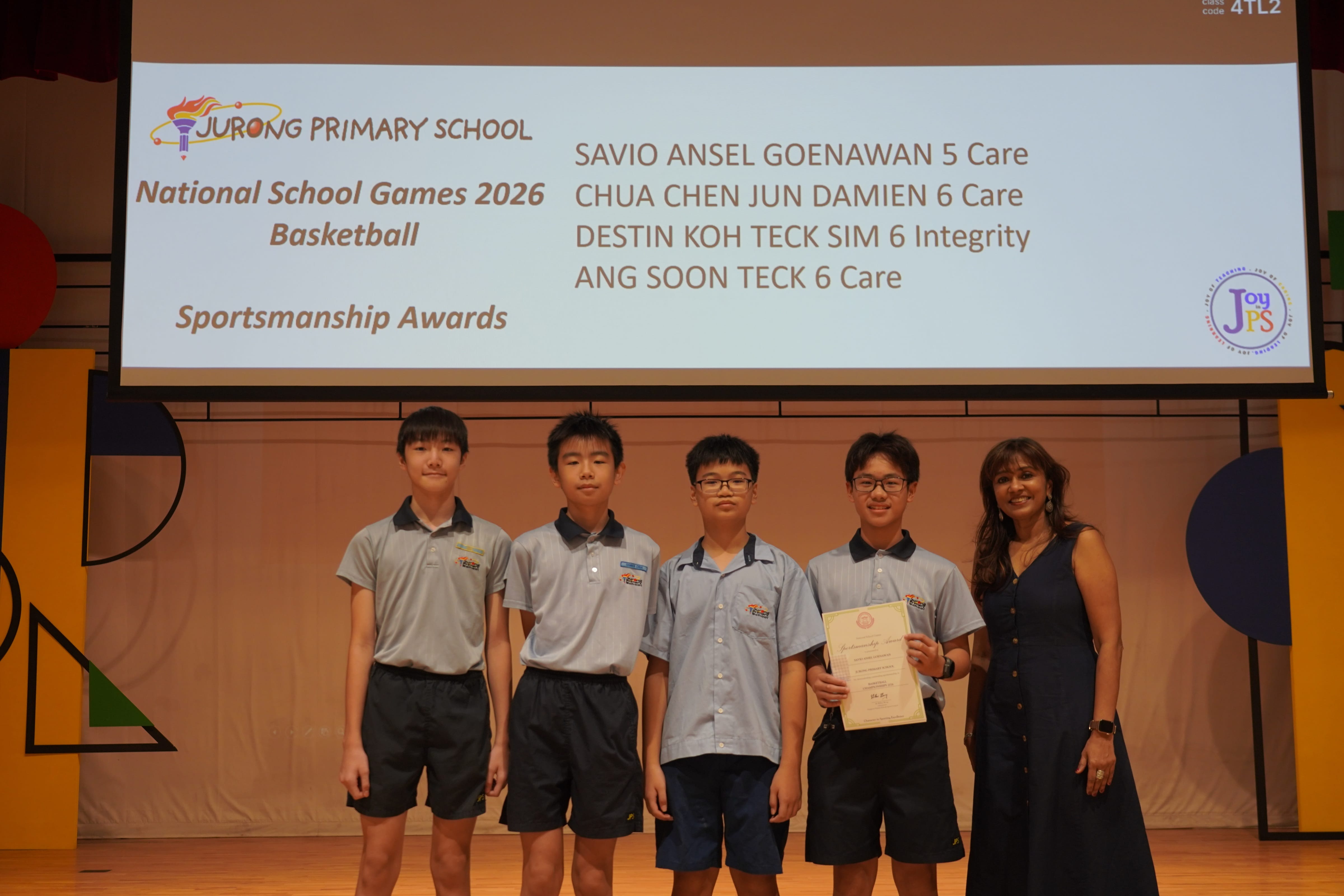Four students holding a certificate with a Vice-Principal, NSG 2026 Basketball Sportsmanship Award.