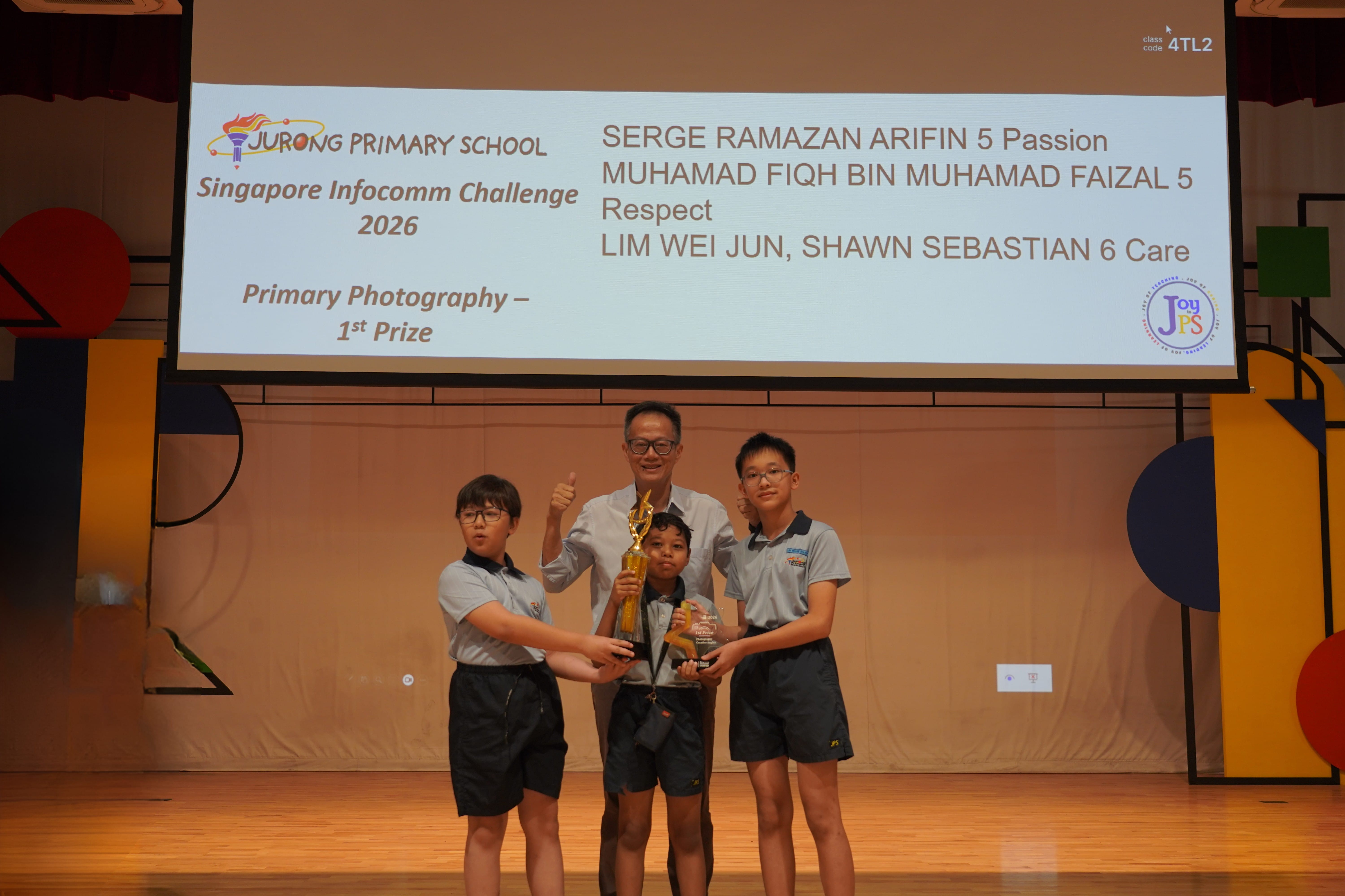 Three boys with a trophy and Vice-Principal, Singapore Infocomm Challenge 2026 Photography 1st Prize.