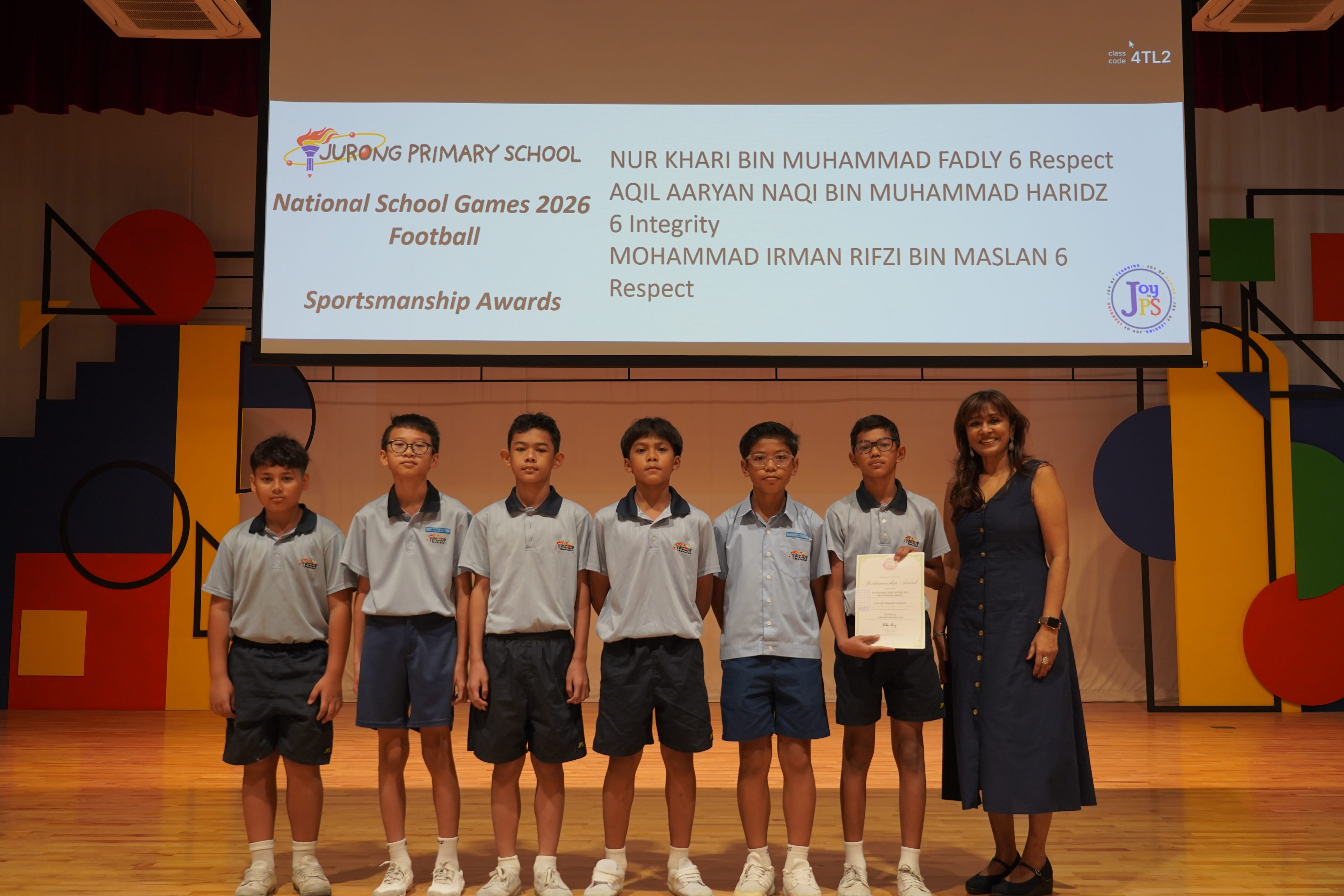 Six students with a certificate and Vice-Principal, National School Games 2026 Football Sportsmanship Award.