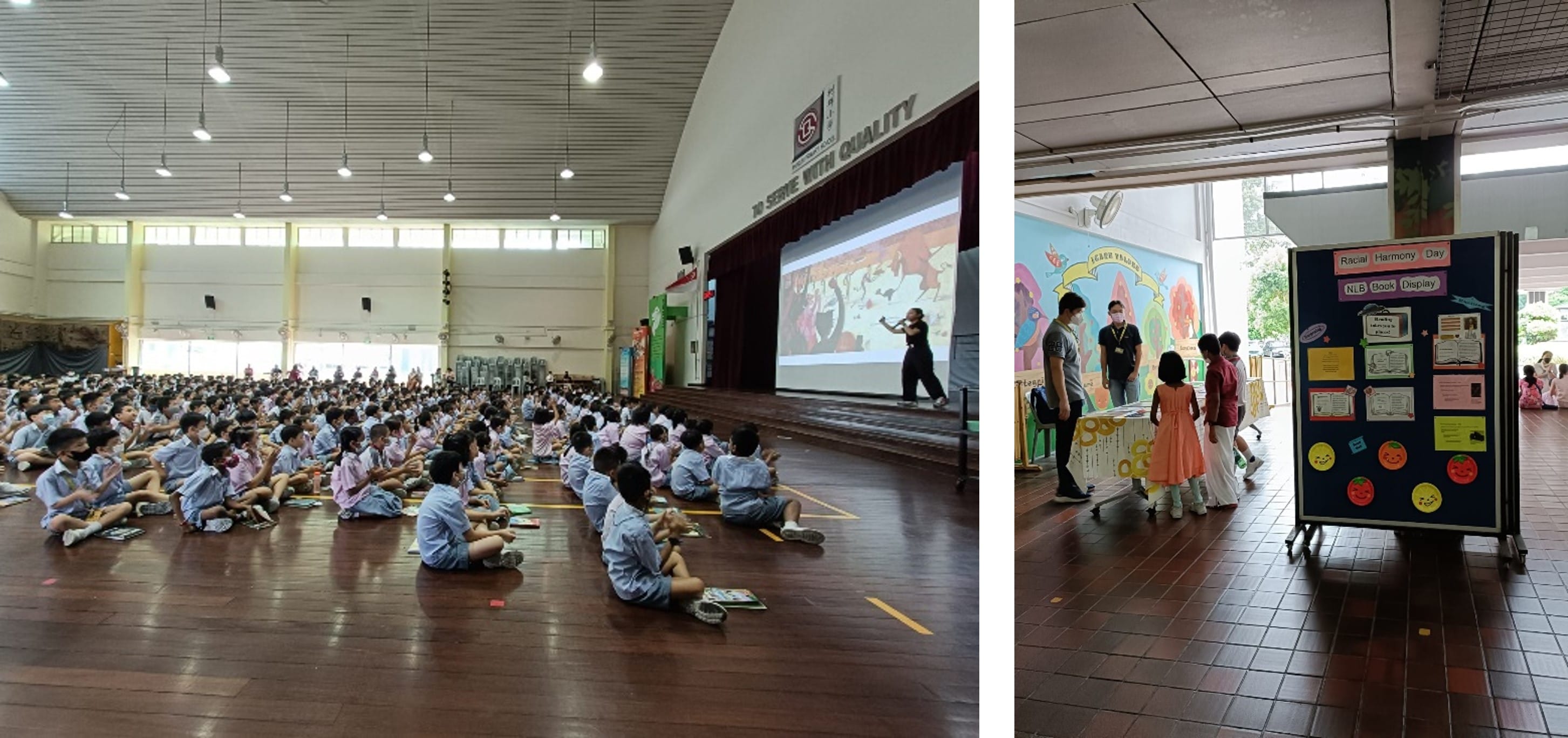 Students sit on a hall floor watching a presentation; nearby, children view a Racial Harmony Day book display board.