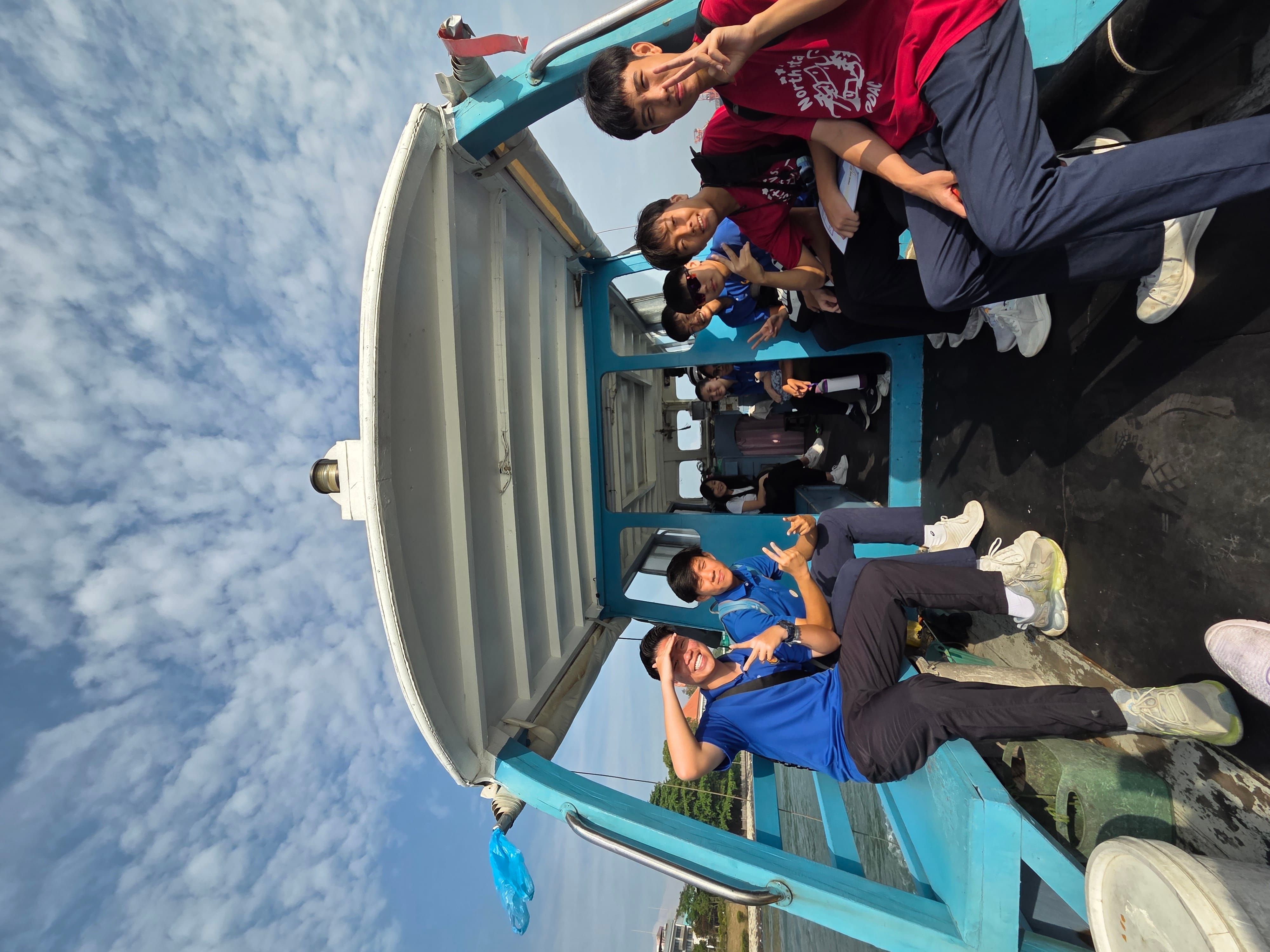 NV students taking the boat to Pulau Ubin